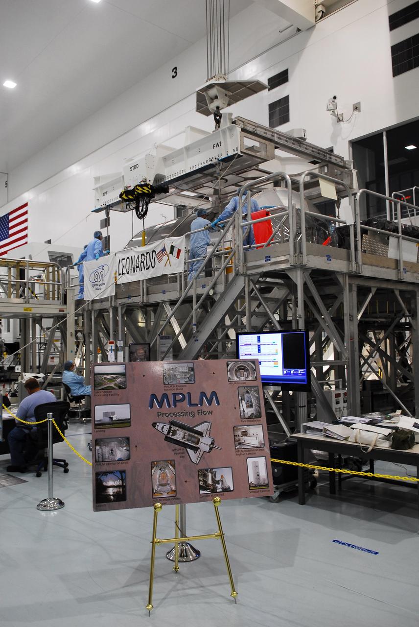 CAPE CANAVERAL, Fla. -- In the Space Station Processing Facility at NASA's Kennedy Space Center in Florida, technicians connect an overhead crane to the Permanent Multipurpose Module, or PMM, for its transfer into a payload canister.        The canister will then be transported to Launch Pad 39A and installed into space shuttle Discovery's payload bay. Discovery and its STS-133 crew will deliver the PMM, packed with supplies and critical spare parts, as well as Robonaut 2, the dexterous humanoid astronaut helper, to the International Space Station. Launch is targeted for 4:40 p.m. EDT, Nov. 1. Photo credit: NASA/Cory Huston