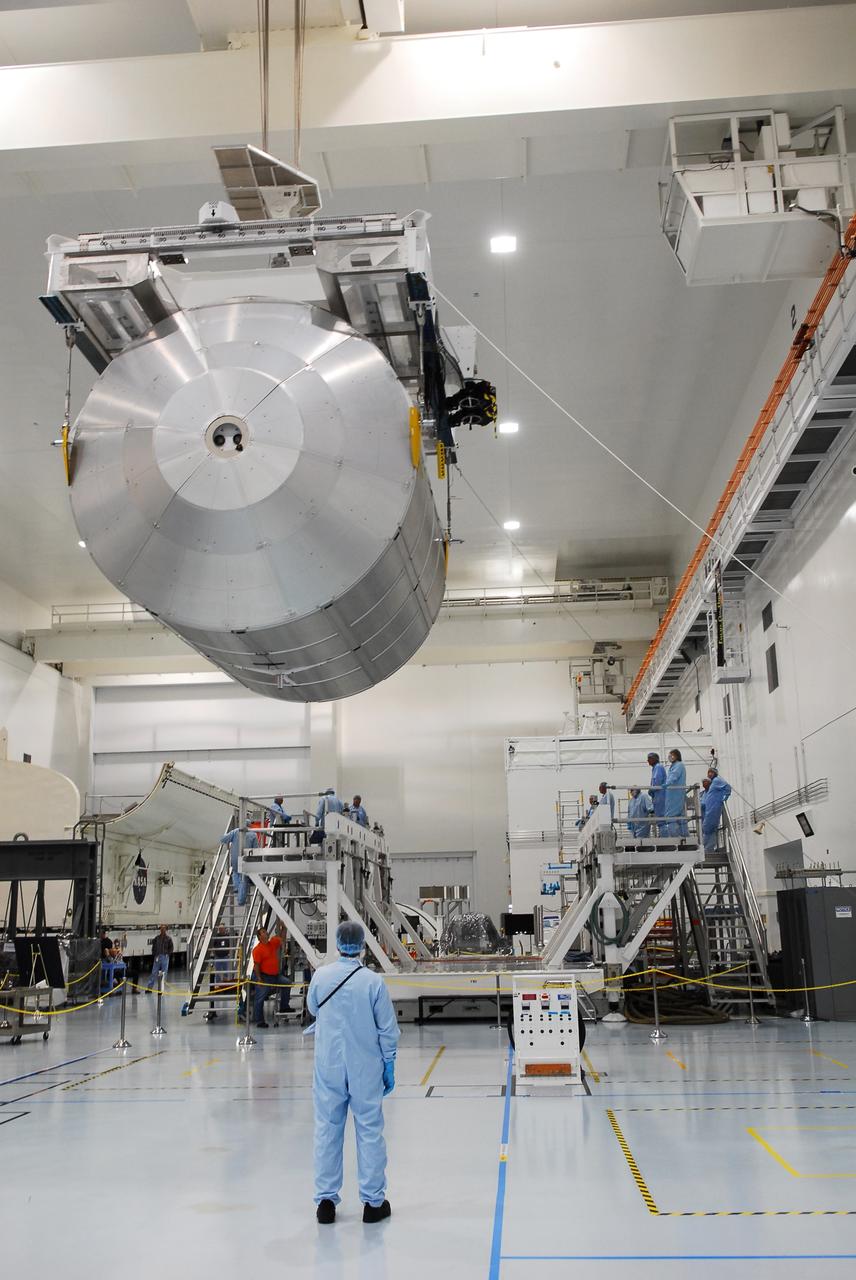 CAPE CANAVERAL, Fla. -- In the Space Station Processing Facility at NASA's Kennedy Space Center in Florida, technicians monitor the progress of the Permanent Multipurpose Module, or PMM, as it is being transferred by overhead crane towards a payload canister.        The canister will then be transported to Launch Pad 39A and installed into space shuttle Discovery's payload bay. Discovery and its STS-133 crew will deliver the PMM, packed with supplies and critical spare parts, as well as Robonaut 2, the dexterous humanoid astronaut helper, to the International Space Station. Launch is targeted for 4:40 p.m. EDT, Nov. 1. Photo credit: NASA/Cory Huston