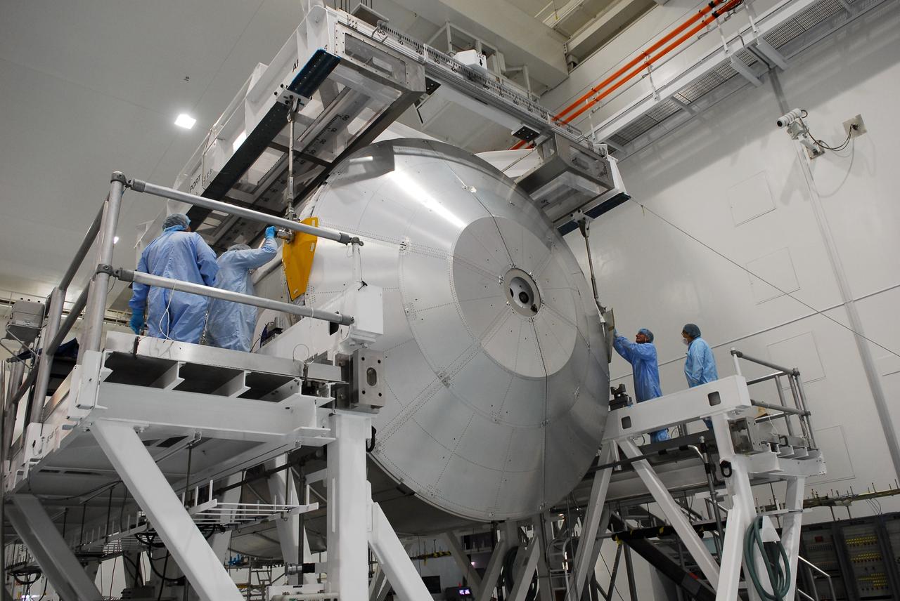 CAPE CANAVERAL, Fla. -- In the Space Station Processing Facility at NASA's Kennedy Space Center in Florida, technicians connect an overhead crane to the Permanent Multipurpose Module, or PMM, for its transfer into a payload canister.        The canister will then be transported to Launch Pad 39A and installed into space shuttle Discovery's payload bay. Discovery and its STS-133 crew will deliver the PMM, packed with supplies and critical spare parts, as well as Robonaut 2, the dexterous humanoid astronaut helper, to the International Space Station. Launch is targeted for 4:40 p.m. EDT, Nov. 1. Photo credit: NASA/Cory Huston