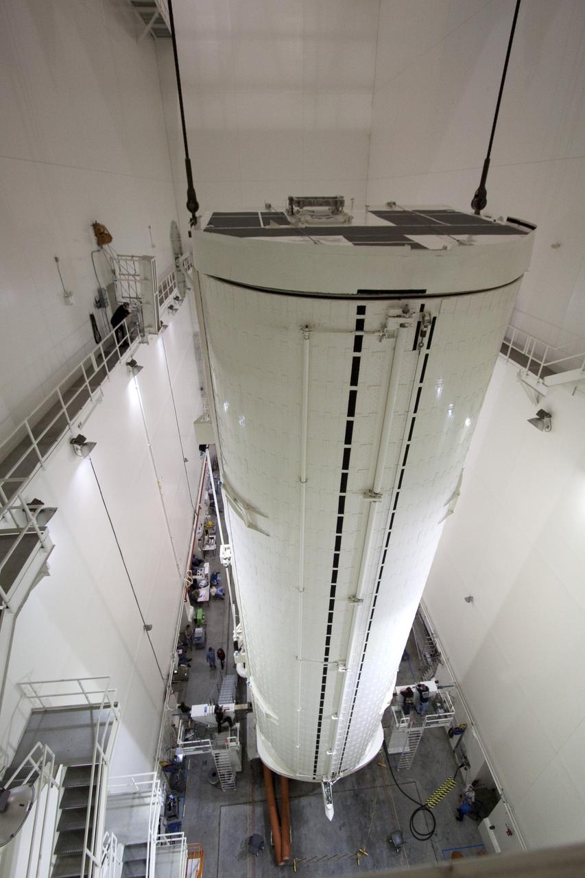 CAPE CANAVERAL, Fla. -- In the Canister Rotation Facility at NASA's Kennedy Space Center in Florida, an overhead crane lifts the payload canister into a vertical position.        The canister will then be delivered to Launch Pad 39A, lifted into the rotating service structure where the module will be moved into the clean room before it is installed into space shuttle Discovery's payload bay. Discovery and its STS-133 crew will deliver the PMM, packed with supplies and critical spare parts, as well as Robonaut 2, the dexterous humanoid astronaut helper, to the International Space Station. Launch is targeted for 4:40 p.m. EDT, Nov. 1. Photo credit: NASA/Jack Pfaller