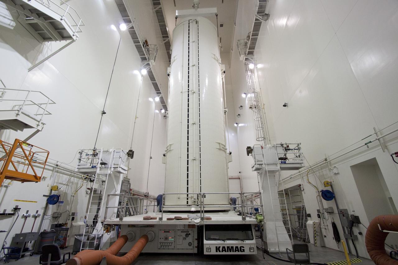 CAPE CANAVERAL, Fla. -- In the Canister Rotation Facility at NASA's Kennedy Space Center in Florida, the payload canister rests on a transport vehicle after being rotated into a vertical position.        The canister will then be delivered to Launch Pad 39A, lifted into the rotating service structure where the module will be moved into the clean room before it is installed into space shuttle Discovery's payload bay. Discovery and its STS-133 crew will deliver the PMM, packed with supplies and critical spare parts, as well as Robonaut 2, the dexterous humanoid astronaut helper, to the International Space Station. Launch is targeted for 4:40 p.m. EDT, Nov. 1. Photo credit: NASA/Jack Pfaller