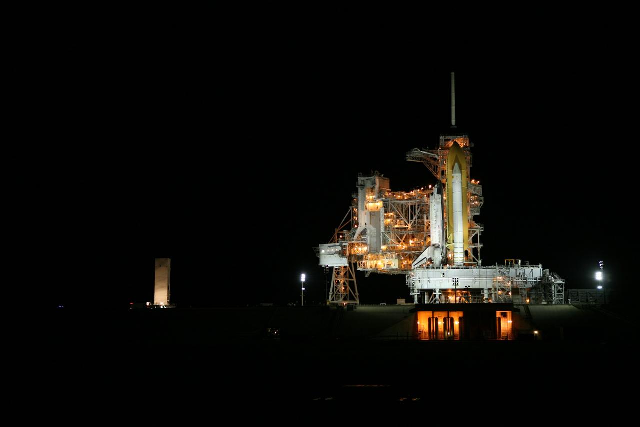 CAPE CANAVERAL, Fla. -- At NASA's Kennedy Space Center in Florida, the STS-133 payload canister approaches Launch Pad 39A where it will be lifted into the rotating service structure.        The payload then will be moved into space shuttle Discovery's payload bay. Discovery and its STS-133 crew will deliver the Permanent Multipurpose Module, packed with supplies and critical spare parts, as well as Robonaut 2, the dexterous humanoid astronaut helper, to the International Space Station. Launch is targeted for 4:40 p.m. EDT, Nov. 1. Photo credit: NASA/Amanda Diller