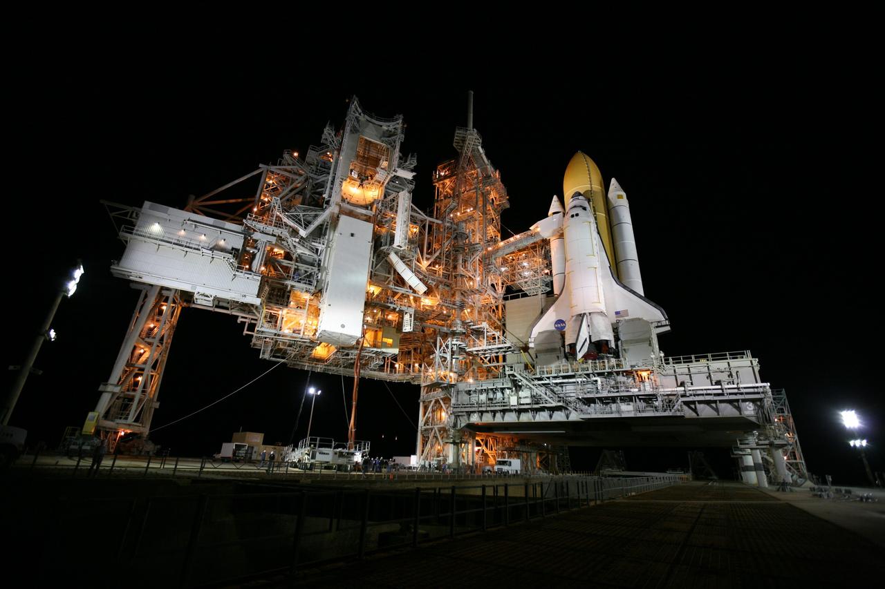 CAPE CANAVERAL, Fla. -- At NASA's Kennedy Space Center in Florida, the STS-133 payload canister is lifted into the rotating service structure on Launch Pad 39A.        The payload then will be moved into space shuttle Discovery's payload bay. Discovery and its STS-133 crew will deliver the Permanent Multipurpose Module, packed with supplies and critical spare parts, as well as Robonaut 2, the dexterous humanoid astronaut helper, to the International Space Station. Launch is targeted for 4:40 p.m. EDT, Nov. 1. Photo credit: NASA/Amanda Diller