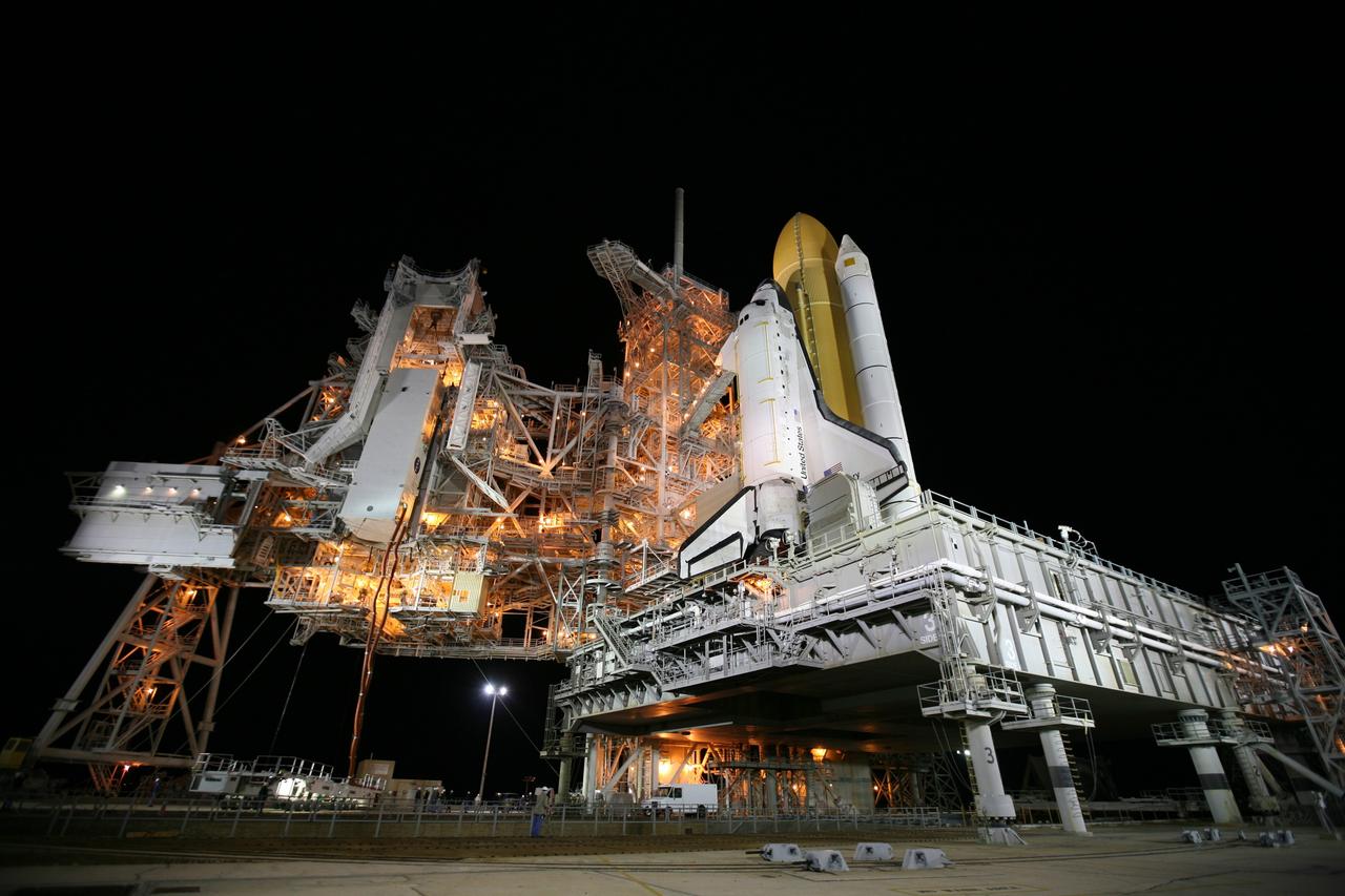 CAPE CANAVERAL, Fla. -- At NASA's Kennedy Space Center in Florida, the STS-133 payload canister is lifted into the rotating service structure on Launch Pad 39A.        The payload then will be moved into space shuttle Discovery's payload bay. Discovery and its STS-133 crew will deliver the Permanent Multipurpose Module, packed with supplies and critical spare parts, as well as Robonaut 2, the dexterous humanoid astronaut helper, to the International Space Station. Launch is targeted for 4:40 p.m. EDT, Nov. 1. Photo credit: NASA/Amanda Diller