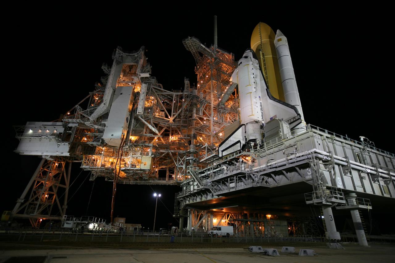 CAPE CANAVERAL, Fla. -- At NASA's Kennedy Space Center in Florida, the STS-133 payload canister is lifted into the rotating service structure on Launch Pad 39A.        The payload then will be moved into space shuttle Discovery's payload bay. Discovery and its STS-133 crew will deliver the Permanent Multipurpose Module, packed with supplies and critical spare parts, as well as Robonaut 2, the dexterous humanoid astronaut helper, to the International Space Station. Launch is targeted for 4:40 p.m. EDT, Nov. 1. Photo credit: NASA/Amanda Diller