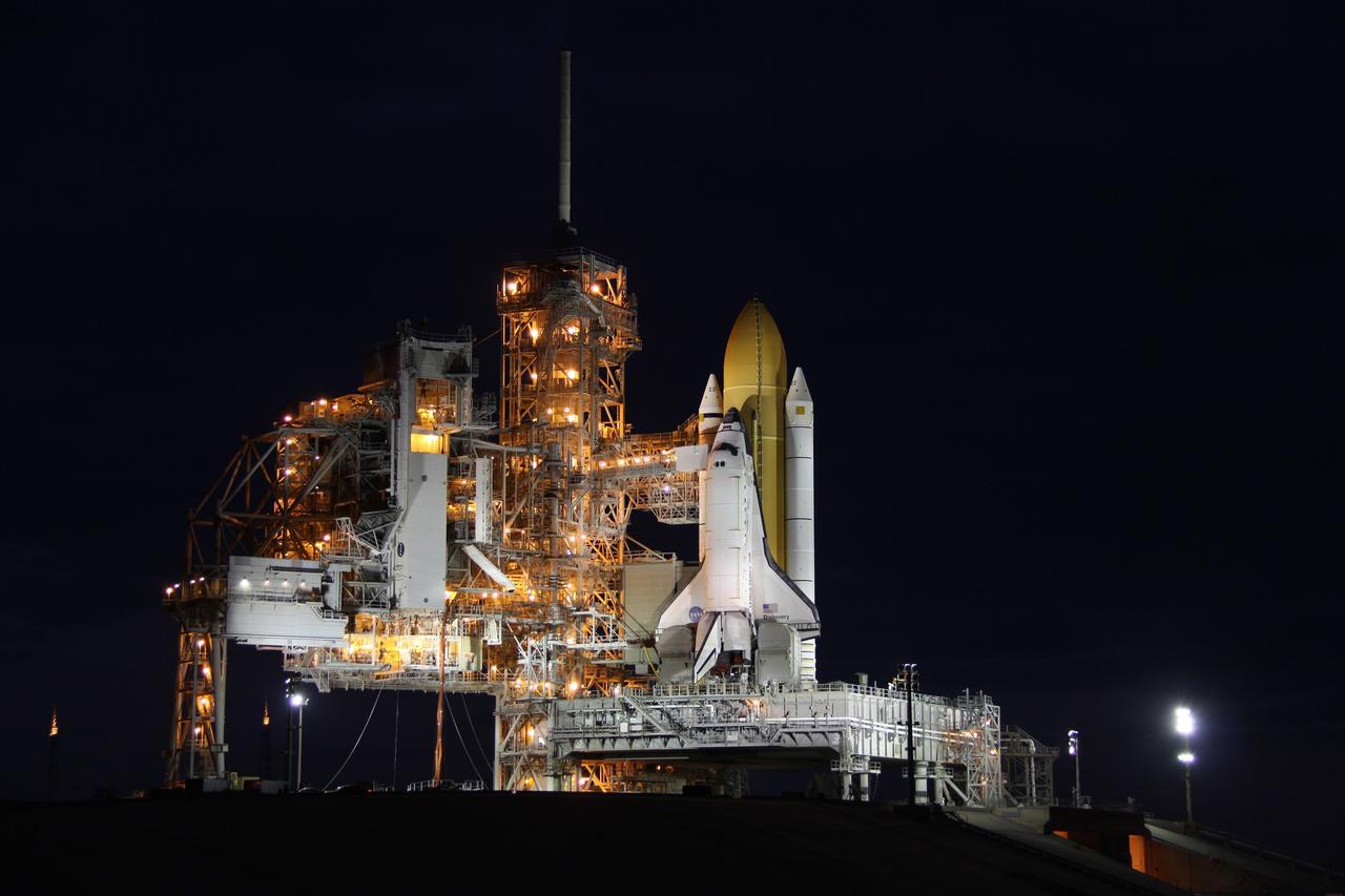 CAPE CANAVERAL, Fla. -- At NASA's Kennedy Space Center in Florida, the STS-133 payload canister is lifted into the rotating service structure on Launch Pad 39A.      The payload then will be moved into space shuttle Discovery's payload bay. Discovery and its STS-133 crew will deliver the Permanent Multipurpose Module, packed with supplies and critical spare parts, as well as Robonaut 2, the dexterous humanoid astronaut helper, to the International Space Station. Launch is targeted for 4:40 p.m. EDT, Nov. 1. Photo credit: NASA/Troy Cryder