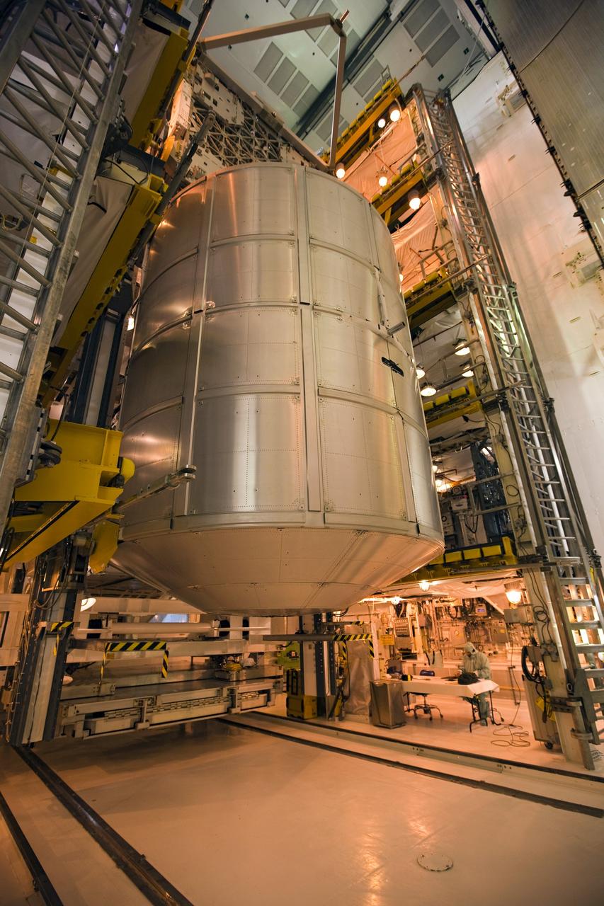 CAPE CANAVERAL, Fla. -- At NASA's Kennedy Space Center in Florida, technicians prepare to move the STS-133 payload from the rotating service structure on Launch Pad 39A to space shuttle Discovery's payload bay. The move paves the way for the Terminal Countdown Demonstration Test (TCDT) this week, which will give the astronauts and teams at Kennedy and NASA's Johnson Space Center in Houston a chance to practice launch day tasks.     Discovery and its STS-133 crew will deliver the Permanent Multipurpose Module, packed with supplies and critical spare parts, as well as Robonaut 2, the dexterous humanoid astronaut helper, to the International Space Station. Launch is targeted for 4:40 p.m. EDT, Nov. 1. Photo credit: NASA/Dimitri Gerondidakis