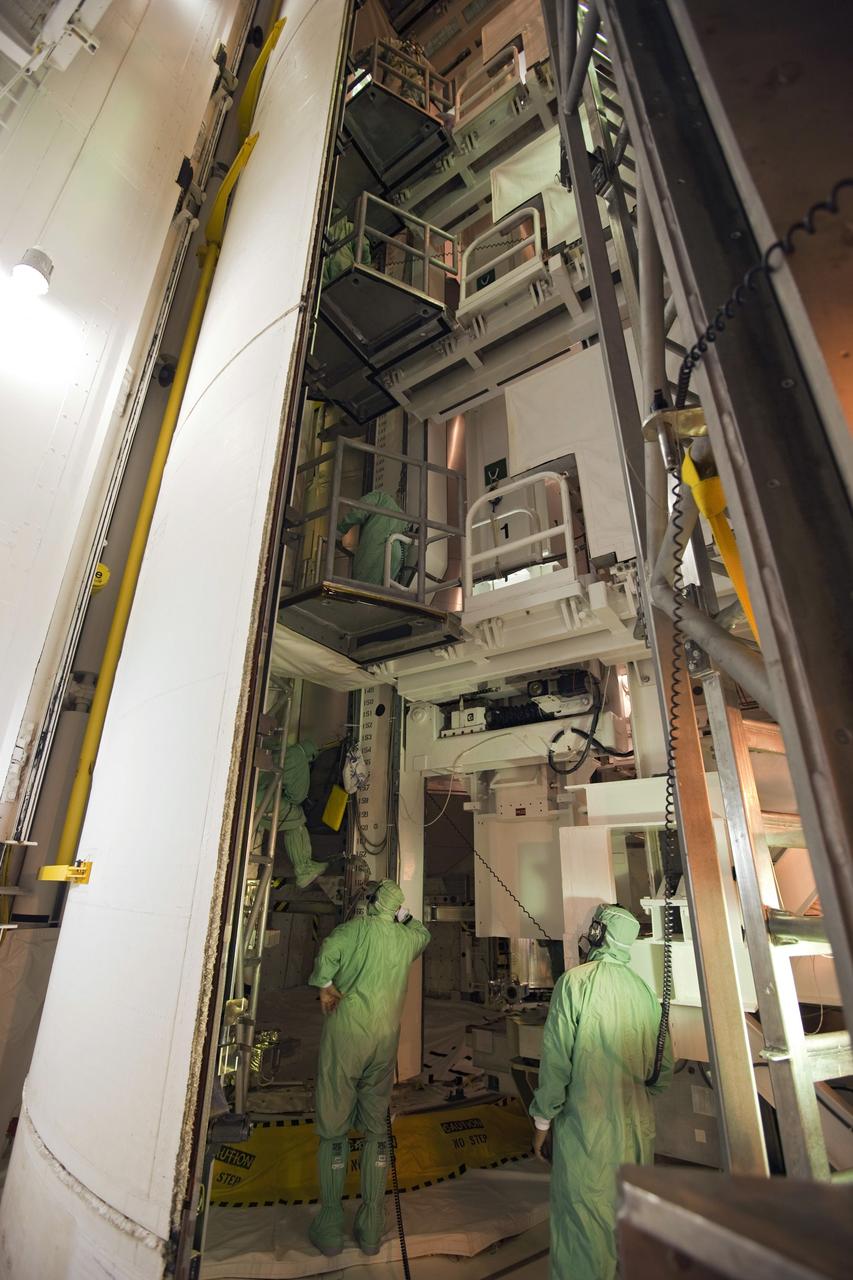 CAPE CANAVERAL, Fla. -- At NASA's Kennedy Space Center in Florida, technicians prepare to move the STS-133 payload from the rotating service structure on Launch Pad 39A to space shuttle Discovery's payload bay. The move paves the way for the Terminal Countdown Demonstration Test (TCDT) this week, which will give the astronauts and teams at Kennedy and NASA's Johnson Space Center in Houston a chance to practice launch day tasks.     Discovery and its STS-133 crew will deliver the Permanent Multipurpose Module, packed with supplies and critical spare parts, as well as Robonaut 2, the dexterous humanoid astronaut helper, to the International Space Station. Launch is targeted for 4:40 p.m. EDT, Nov. 1. Photo credit: NASA/Dimitri Gerondidakis
