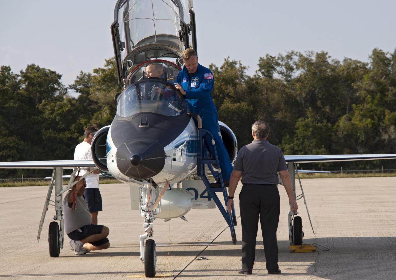 CAPE CANAVERAL, Fla. -- STS-133 Commander Steve Lindsey and Mission Specialist Tim Kopra arrive in a T-38 jet at the Shuttle Landing Facility at NASA's Kennedy Space Center in Florida. The STS-133 crew members are at Kennedy for a practice launch dress rehearsal called the Terminal Countdown Demonstration Test (TCDT) in preparation for their upcoming mission.        TCDT provides each shuttle crew and launch team with an opportunity to participate in various simulated countdown activities, including equipment familiarization and emergency training. Space shuttle Discovery and its STS-133 crew will deliver the Permanent Multipurpose Module, packed with supplies and critical spare parts, as well as Robonaut 2, the dexterous humanoid astronaut helper, to the International Space Station. Launch is targeted for Nov. 1 at 4:40 p.m. For more information on the STS-133 mission, visit www.nasa.gov/shuttle. Photo credit: NASA/Jack Pfaller