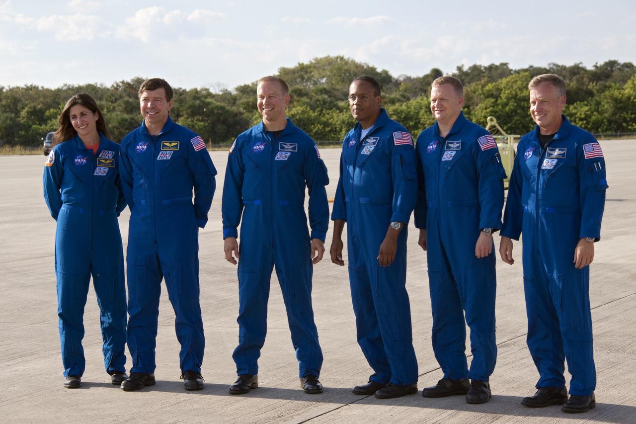 CAPE CANAVERAL, Fla. -- At NASA's Kennedy Space Center in Florida, the STS-133 crew poses for a group portrait following their arrival for a practice launch dress rehearsal called the Terminal Countdown Demonstration Test (TCDT). From left are Mission Specialists Nicole Stott, Michael Barratt, Tim Kopra, Alvin Drew; Pilot Eric Boe and Commander Steve Lindsey.         TCDT provides each shuttle crew and launch team with an opportunity to participate in various simulated countdown activities, including equipment familiarization and emergency training. Space shuttle Discovery and its STS-133 crew will deliver the Permanent Multipurpose Module, packed with supplies and critical spare parts, as well as Robonaut 2, the dexterous humanoid astronaut helper, to the International Space Station. Launch is targeted for Nov. 1 at 4:40 p.m. For more information on the STS-133 mission, visit www.nasa.gov/shuttle. Photo credit: NASA/Jack Pfaller