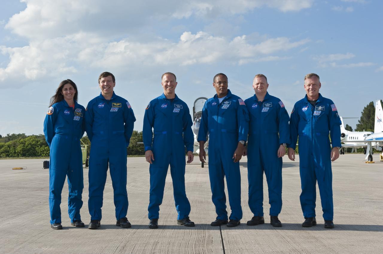 CAPE CANAVERAL, Fla. -- At NASA's Kennedy Space Center in Florida, the STS-133 crew poses for a group portrait following their arrival for a practice launch dress rehearsal called the Terminal Countdown Demonstration Test (TCDT). From left are Mission Specialists Nicole Stott, Michael Barratt, Tim Kopra, Alvin Drew; Pilot Eric Boe and Commander Steve Lindsey.       TCDT provides each shuttle crew and launch team with an opportunity to participate in various simulated countdown activities, including equipment familiarization and emergency training. Space shuttle Discovery and its STS-133 crew will deliver the Permanent Multipurpose Module, packed with supplies and critical spare parts, as well as Robonaut 2, the dexterous humanoid astronaut helper, to the International Space Station. Launch is targeted for Nov. 1 at 4:40 p.m. For more information on the STS-133 mission, visit www.nasa.gov/shuttle. Photo credit: NASA/Kim Shiflett