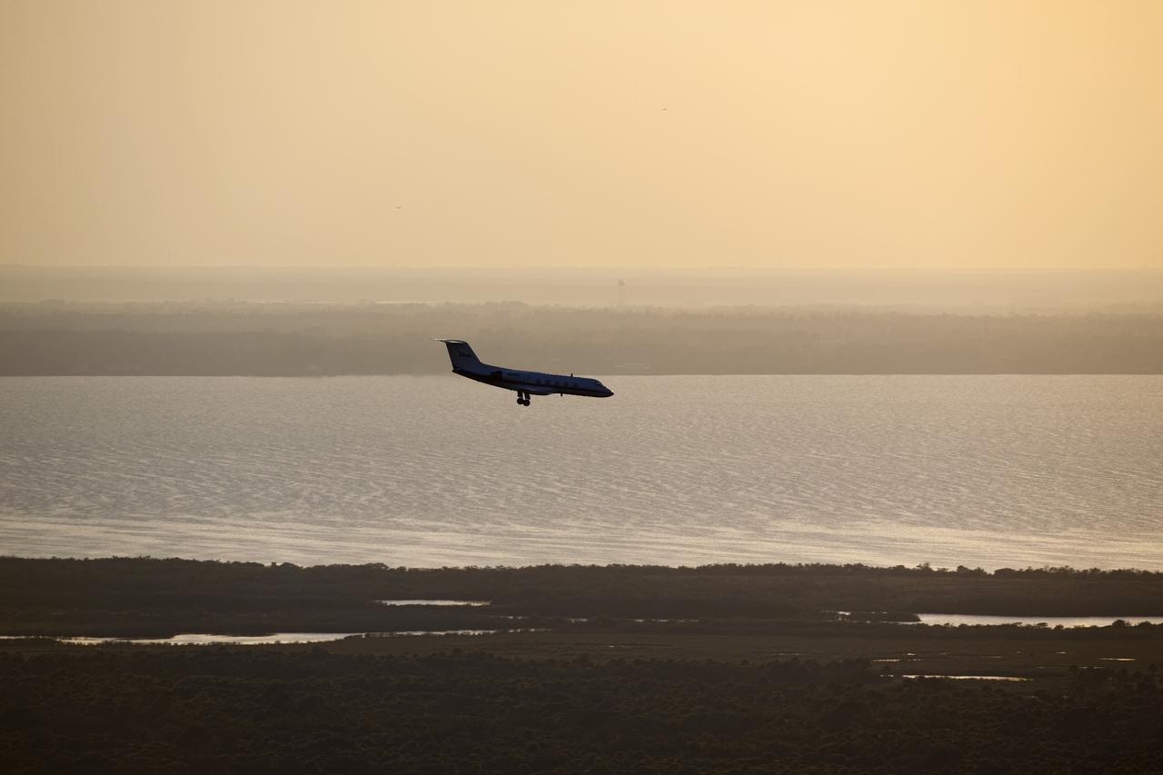CAPE CANAVERAL, Fla. -- A Shuttle Training Aircraft (STA) performs touch-and-go landings over the Shuttle Landing Facility runway at NASA's Kennedy Space Center in Florida. STS-133 Commander Steve Lindsey and Pilot Eric Boe are flying two Gulfstream II business jets that are modified to mimic the shuttle's handling during the final phase of landing. Practice landings are part of the Terminal Countdown Demonstration Test (TCDT), which provides each shuttle crew and launch team an opportunity to participate in various simulated activities, including equipment familiarization and emergency training at the launch pad.        Space shuttle Discovery and its STS-133 crew will deliver the Permanent Multipurpose Module, packed with supplies and critical spare parts, as well as Robonaut 2, the dexterous humanoid astronaut helper, to the International Space Station. Launch is targeted for Nov. 1 at 4:40 p.m. For more information on the STS-133 mission, visit www.nasa.gov/mission_pages/shuttle/shuttlemissions/sts133/. Photo credit: NASA/Dimitri Gerondidakis