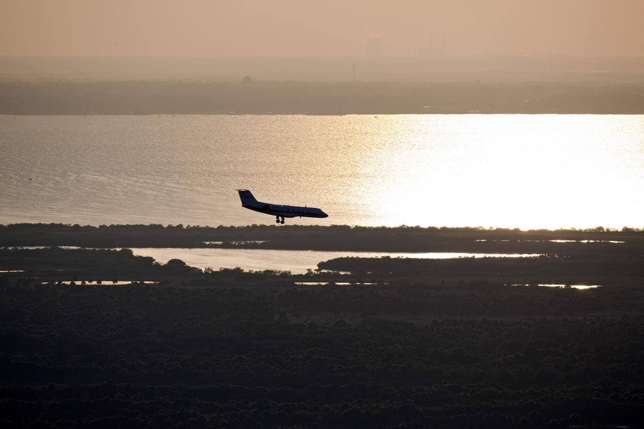 CAPE CANAVERAL, Fla. -- A Shuttle Training Aircraft (STA) performs touch-and-go landings as the sun sets over the Shuttle Landing Facility runway at NASA's Kennedy Space Center in Florida. STS-133 Commander Steve Lindsey and Pilot Eric Boe are flying two Gulfstream II business jets that are modified to mimic the shuttle's handling during the final phase of landing. Practice landings are part of the Terminal Countdown Demonstration Test (TCDT), which provides each shuttle crew and launch team an opportunity to participate in various simulated activities, including equipment familiarization and emergency training at the launch pad.        Space shuttle Discovery and its STS-133 crew will deliver the Permanent Multipurpose Module, packed with supplies and critical spare parts, as well as Robonaut 2, the dexterous humanoid astronaut helper, to the International Space Station. Launch is targeted for Nov. 1 at 4:40 p.m. For more information on the STS-133 mission, visit www.nasa.gov/mission_pages/shuttle/shuttlemissions/sts133/. Photo credit: NASA/Dimitri Gerondidakis