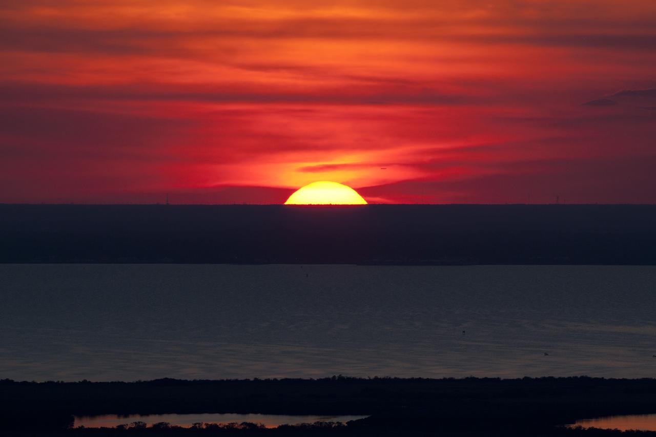 CAPE CANAVERAL, Fla. -- While performing touch-and-go landings over the Shuttle Landing Facility runway, STS-133 Commander Steve Lindsey and Pilot Eric Boe enjoyed a perfect sunset over NASA's Kennedy Space Center in Florida. Lindsey and Boe flew two Shuttle Training Aircraft (STA), which are Gulfstream II business jets modified to mimic the shuttle's handling during the final phase of landing. Practice landings are part of the Terminal Countdown Demonstration Test (TCDT), which provides each shuttle crew and launch team an opportunity to participate in various simulated activities, including equipment familiarization and emergency training at the launch pad.        Space shuttle Discovery and its STS-133 crew will deliver the Permanent Multipurpose Module, packed with supplies and critical spare parts, as well as Robonaut 2, the dexterous humanoid astronaut helper, to the International Space Station. Launch is targeted for Nov. 1 at 4:40 p.m. For more information on the STS-133 mission, visit www.nasa.gov/mission_pages/shuttle/shuttlemissions/sts133/. Photo credit: NASA/Dimitri Gerondidakis