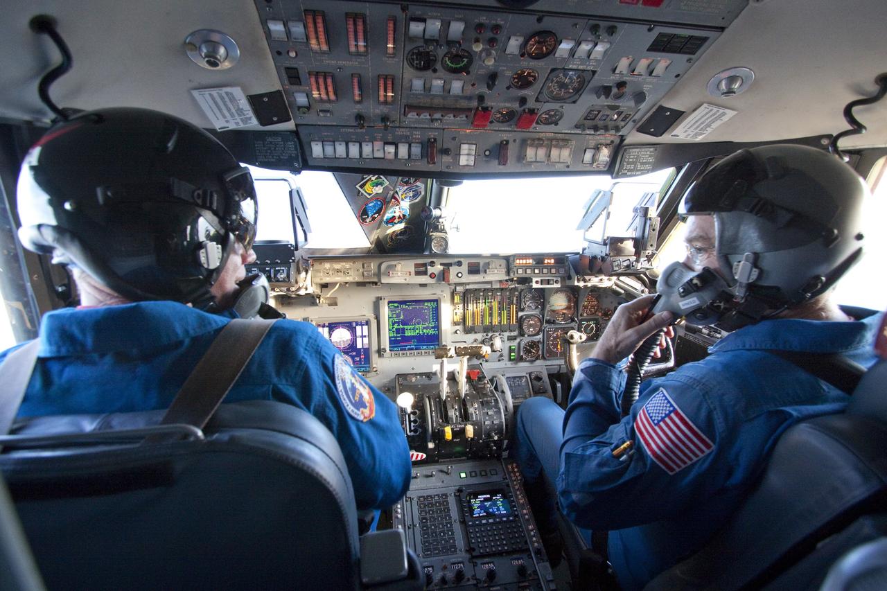 CAPE CANAVERAL, Fla. -- STS-133 Commander Steve Lindsey, left, straps in and prepares to fly touch-and-go landings in a Shuttle Training Aircraft (STA) on the Shuttle Landing Facility runway at NASA's Kennedy Space Center in Florida. At right is Bruce Arnold, an STA instructor pilot. Lindsey and STS-133 Pilot Eric Boe will fly two of the Gulfstream II business jets that are modified to mimic the shuttle's handling during the final phase of landing. Practice landings are part of the Terminal Countdown Demonstration Test (TCDT), which provides each shuttle crew and launch team an opportunity to participate in various simulated activities, including equipment familiarization and emergency training at the launch pad.      Space shuttle Discovery and its STS-133 crew will deliver the Permanent Multipurpose Module, packed with supplies and critical spare parts, as well as Robonaut 2, the dexterous humanoid astronaut helper, to the International Space Station. Launch is targeted for Nov. 1 at 4:40 p.m. For more information on the STS-133 mission, visit www.nasa.gov/mission_pages/shuttle/shuttlemissions/sts133/. Photo credit: NASA/Jack Pfaller