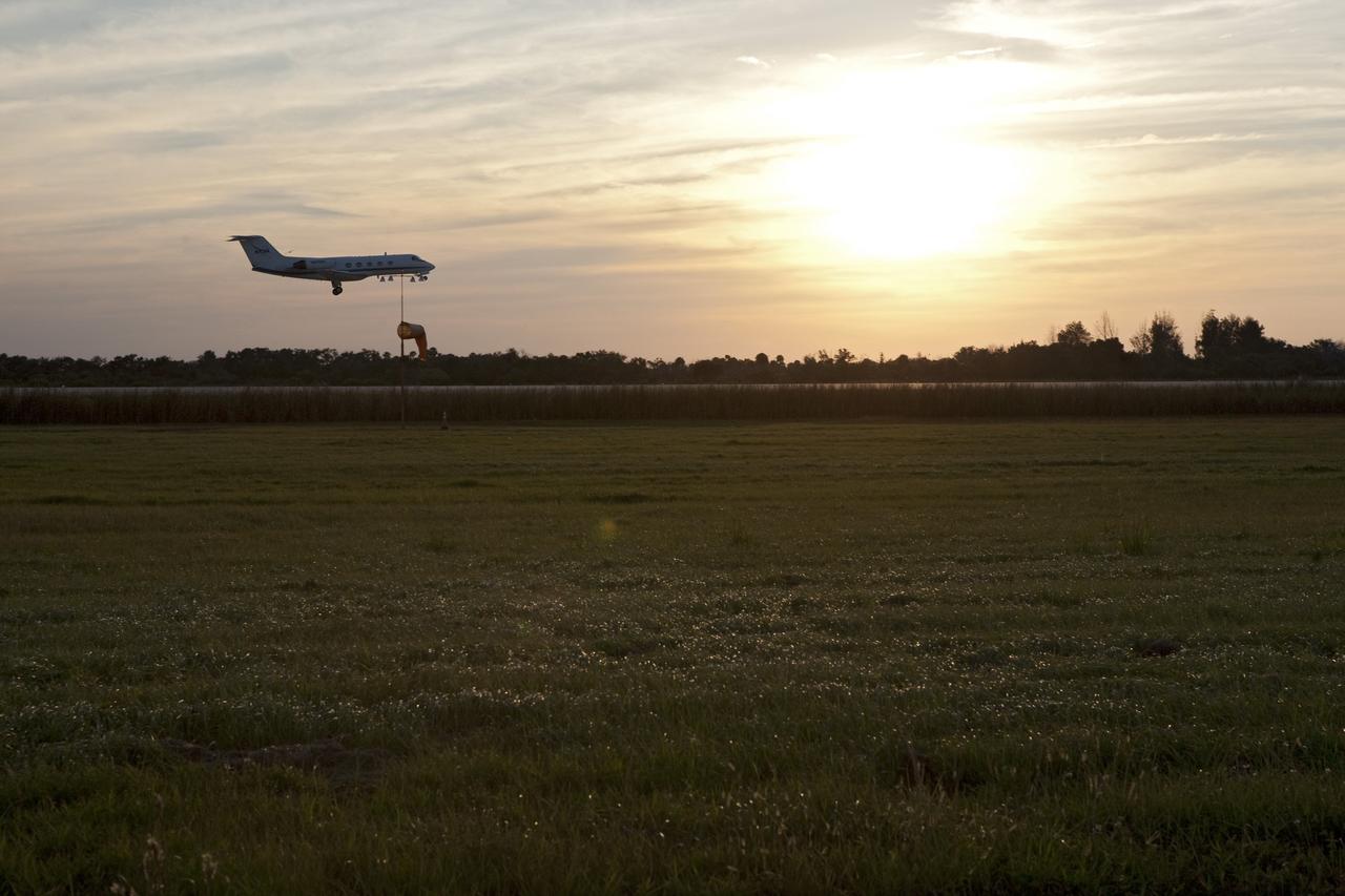 CAPE CANAVERAL, Fla. -- A Shuttle Training Aircraft (STA) performs touch-and-go landings as the sun sets over the Shuttle Landing Facility runway at NASA's Kennedy Space Center in Florida. STS-133 Commander Steve Lindsey and Pilot Eric Boe are flying two Gulfstream II business jets that are modified to mimic the shuttle's handling during the final phase of landing. Practice landings are part of the Terminal Countdown Demonstration Test (TCDT), which provides each shuttle crew and launch team an opportunity to participate in various simulated activities, including equipment familiarization and emergency training at the launch pad.        Space shuttle Discovery and its STS-133 crew will deliver the Permanent Multipurpose Module, packed with supplies and critical spare parts, as well as Robonaut 2, the dexterous humanoid astronaut helper, to the International Space Station. Launch is targeted for Nov. 1 at 4:40 p.m. For more information on the STS-133 mission, visit www.nasa.gov/mission_pages/shuttle/shuttlemissions/sts133/. Photo credit: NASA/Amanda Diller