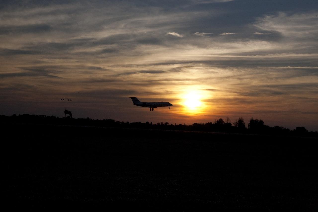 CAPE CANAVERAL, Fla. -- A Shuttle Training Aircraft (STA) performs touch-and-go landings as the sun sets over the Shuttle Landing Facility runway at NASA's Kennedy Space Center in Florida. STS-133 Commander Steve Lindsey and Pilot Eric Boe are flying two Gulfstream II business jets that are modified to mimic the shuttle's handling during the final phase of landing. Practice landings are part of the Terminal Countdown Demonstration Test (TCDT), which provides each shuttle crew and launch team an opportunity to participate in various simulated activities, including equipment familiarization and emergency training at the launch pad.        Space shuttle Discovery and its STS-133 crew will deliver the Permanent Multipurpose Module, packed with supplies and critical spare parts, as well as Robonaut 2, the dexterous humanoid astronaut helper, to the International Space Station. Launch is targeted for Nov. 1 at 4:40 p.m. For more information on the STS-133 mission, visit www.nasa.gov/mission_pages/shuttle/shuttlemissions/sts133/. Photo credit: NASA/Amanda Diller