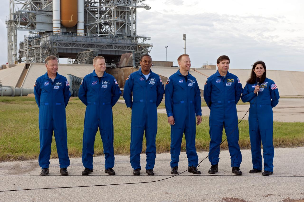 CAPE CANAVERAL, Fla. -- At NASA's Kennedy Space Center in Florida, STS-133 Mission Specialist Nicole Stott talks to media at Launch Pad 39A, where space shuttle Discovery is poised for launch next month. The six STS-133 crew members, from left, are Commander Steve Lindsey, Pilot Eric Boe, and Mission Specialists Alvin Drew, Tim Kopra, Michael Barratt, and Stott. The crew is at Kennedy for the Terminal Countdown Demonstration Test (TCDT), which provides each shuttle crew and launch team an opportunity to participate in various simulated activities, including equipment familiarization and emergency training at the launch pad. Discovery and its crew will deliver the Permanent Multipurpose Module, packed with supplies and critical spare parts, as well as Robonaut 2, the dexterous humanoid astronaut helper, to the International Space Station. Launch is targeted for Nov. 1 at 4:40 p.m. For more information on the STS-133 mission, visit www.nasa.gov/mission_pages/shuttle/shuttlemissions/sts133/. Photo credit: NASA/Kim Shiflett
