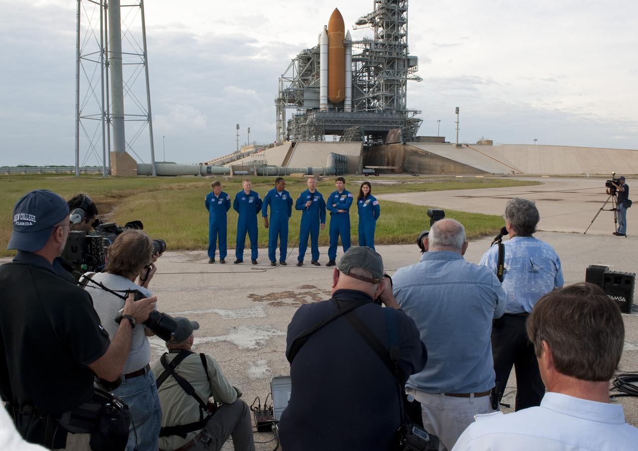 CAPE CANAVERAL, Fla. -- At NASA's Kennedy Space Center in Florida, media ask STS-133 Mission Specialist Tim Kopra questions at Launch Pad 39A, where space shuttle Discovery is poised for launch next month. The six STS-133 crew members, from left, are Commander Steve Lindsey, Pilot Eric Boe, and Mission Specialists Alvin Drew, Kopra, Michael Barratt, and Nicole Stott. The crew is at Kennedy for the Terminal Countdown Demonstration Test (TCDT), which provides each shuttle crew and launch team an opportunity to participate in various simulated activities, including equipment familiarization and emergency training at the launch pad. Discovery and its crew will deliver the Permanent Multipurpose Module, packed with supplies and critical spare parts, as well as Robonaut 2, the dexterous humanoid astronaut helper, to the International Space Station. Launch is targeted for Nov. 1 at 4:40 p.m. For more information on the STS-133 mission, visit www.nasa.gov/mission_pages/shuttle/shuttlemissions/sts133/. Photo credit: NASA/Kim Shiflett