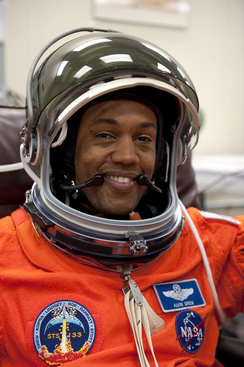 CAPE CANAVERAL, Fla. -- STS-133 Mission Specialist Alvin Drew is suited up in the Operations and Checkout Building at NASA's Kennedy Space Center in Florida during a simulated launch countdown. Checking the fit of their orange launch-and-entry suits and helmets before launch day is part of the Terminal Countdown Demonstration Test (TCDT), which provides each shuttle crew and launch team an opportunity to participate in various simulated activities, including equipment familiarization and emergency training at the launch pad. Space shuttle Discovery and its STS-133 crew will deliver the Permanent Multipurpose Module, packed with supplies and critical spare parts, as well as Robonaut 2, the dexterous humanoid astronaut helper, to the International Space Station. Launch is targeted for Nov. 1 at 4:40 p.m. For more information on the STS-133 mission, visit www.nasa.gov/mission_pages/shuttle/shuttlemissions/sts133/. Photo credit: NASA/Kim Shiflett
