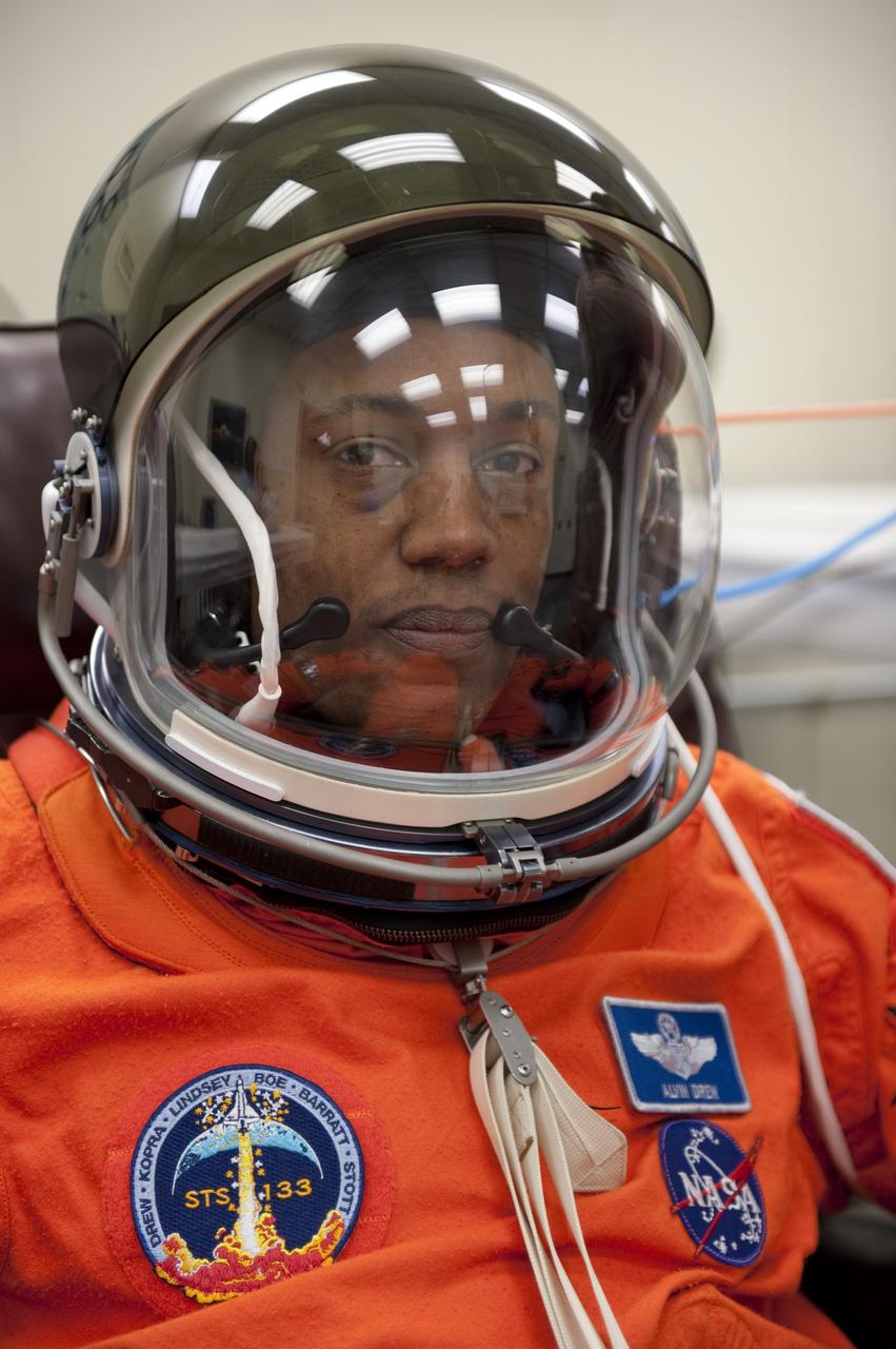 CAPE CANAVERAL, Fla. -- STS-133 Mission Specialist Alvin Drew is suited up in the Operations and Checkout Building at NASA's Kennedy Space Center in Florida during a simulated launch countdown. Checking the fit of their orange launch-and-entry suits and helmets before launch day is part of the Terminal Countdown Demonstration Test (TCDT), which provides each shuttle crew and launch team an opportunity to participate in various simulated activities, including equipment familiarization and emergency training at the launch pad. Space shuttle Discovery and its STS-133 crew will deliver the Permanent Multipurpose Module, packed with supplies and critical spare parts, as well as Robonaut 2, the dexterous humanoid astronaut helper, to the International Space Station. Launch is targeted for Nov. 1 at 4:40 p.m. For more information on the STS-133 mission, visit www.nasa.gov/mission_pages/shuttle/shuttlemissions/sts133/. Photo credit: NASA/Kim Shiflett
