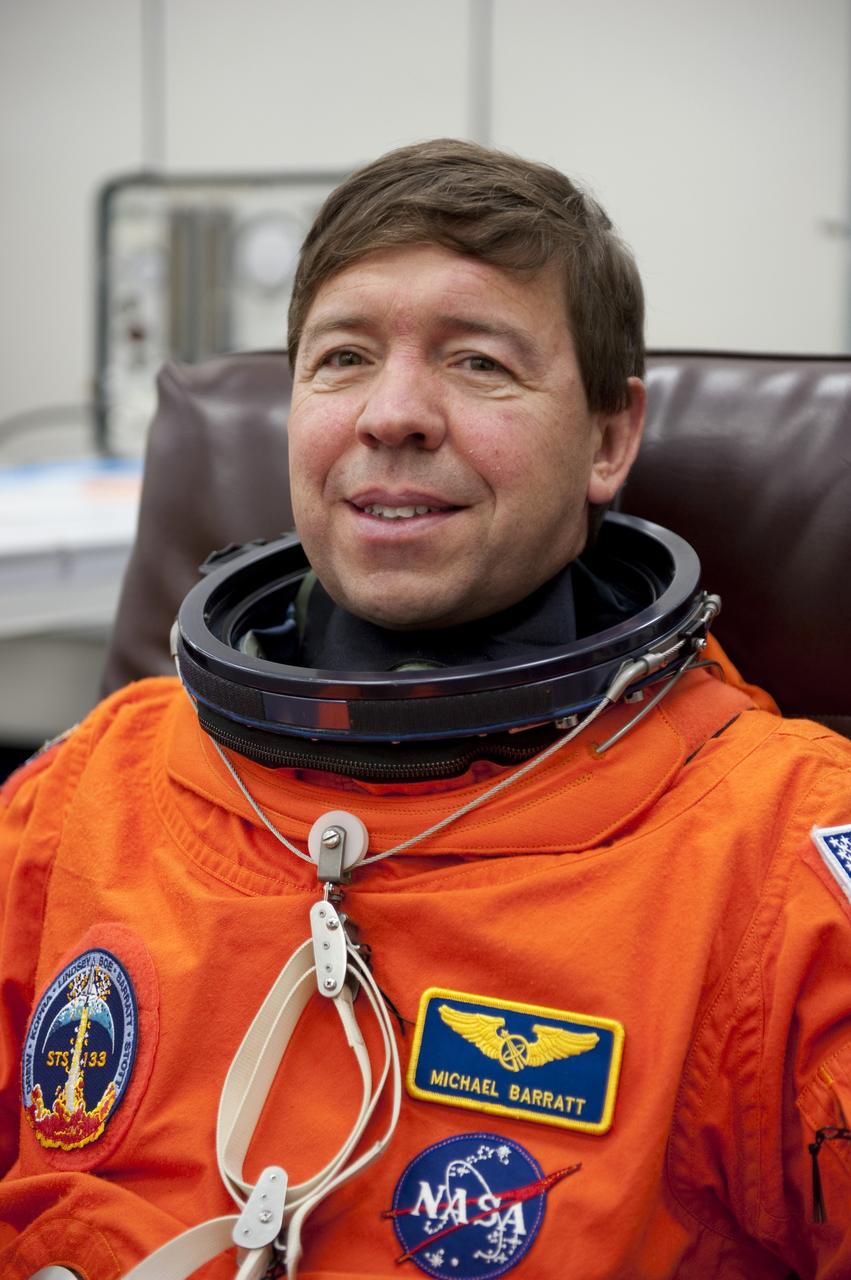 CAPE CANAVERAL, Fla. -- STS-133 Mission Specialist Michael Barratt is suited up in the Operations and Checkout Building at NASA's Kennedy Space Center in Florida during a simulated launch countdown. Checking the fit of their orange launch-and-entry suits and helmets before launch day is part of the Terminal Countdown Demonstration Test (TCDT), which provides each shuttle crew and launch team an opportunity to participate in various simulated activities, including equipment familiarization and emergency training at the launch pad. Space shuttle Discovery and its STS-133 crew will deliver the Permanent Multipurpose Module, packed with supplies and critical spare parts, as well as Robonaut 2, the dexterous humanoid astronaut helper, to the International Space Station. Launch is targeted for Nov. 1 at 4:40 p.m. For more information on the STS-133 mission, visit www.nasa.gov/mission_pages/shuttle/shuttlemissions/sts133/. Photo credit: NASA/Kim Shiflett
