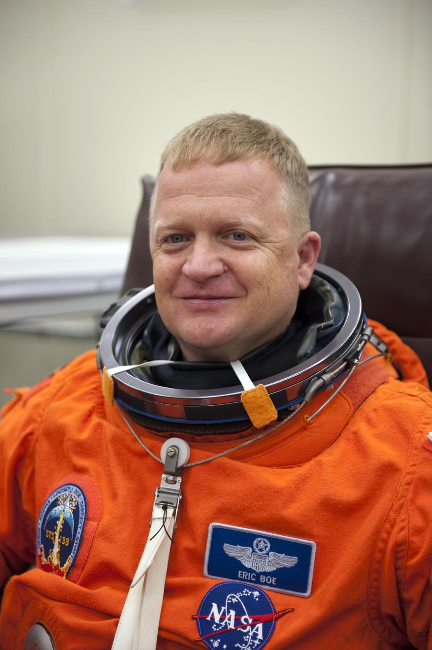 CAPE CANAVERAL, Fla. -- STS-133 Pilot Eric Boe is suited up in the Operations and Checkout Building at NASA's Kennedy Space Center in Florida during a simulated launch countdown. Checking the fit of their orange launch-and-entry suits and helmets before launch day is part of the Terminal Countdown Demonstration Test (TCDT), which provides each shuttle crew and launch team an opportunity to participate in various simulated activities, including equipment familiarization and emergency training at the launch pad. Space shuttle Discovery and its STS-133 crew will deliver the Permanent Multipurpose Module, packed with supplies and critical spare parts, as well as Robonaut 2, the dexterous humanoid astronaut helper, to the International Space Station. Launch is targeted for Nov. 1 at 4:40 p.m. For more information on the STS-133 mission, visit www.nasa.gov/mission_pages/shuttle/shuttlemissions/sts133/. Photo credit: NASA/Kim Shiflett