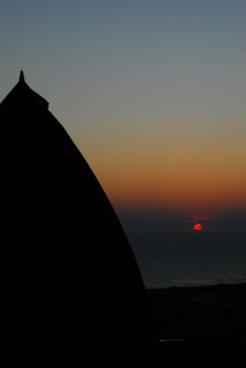 CAPE CANAVERAL, Fla. -- As the sun begins to rise at Launch Pad 39A at NASA's Kennedy Space Center in Florida, the STS-133 crew members are in the pad's White Room preparing to board space shuttle Discovery during the Terminal Countdown Demonstration Test (TCDT). Part of TCDT includes practicing the final hours of a real launch day when astronauts put on their launch-and-entry suits, ride to the pad in the Astrovan and strap into the shuttle.    Discovery and its STS-133 crew will deliver the Permanent Multipurpose Module, packed with supplies and critical spare parts, as well as Robonaut 2, the dexterous humanoid astronaut helper, to the International Space Station. Launch is targeted for Nov. 1 at 4:40 p.m. For more information on the STS-133 mission, visit www.nasa.gov/mission_pages/shuttle/shuttlemissions/sts133/. Photo credit: NASA/Jim Grossmann