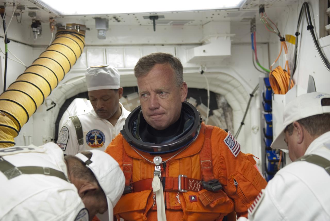 CAPE CANAVERAL, Fla. -- In the White Room of Launch Pad 39A at NASA's Kennedy Space Center in Florida, STS-133 Commander Steve Lindsey prepares to board space shuttle Discovery during the Terminal Countdown Demonstration Test (TCDT). Part of TCDT includes practicing the final hours of a real launch day when astronauts put on their launch-and-entry suits, ride to the pad in the Astrovan and strap into the shuttle.    Discovery and its STS-133 crew will deliver the Permanent Multipurpose Module, packed with supplies and critical spare parts, as well as Robonaut 2, the dexterous humanoid astronaut helper, to the International Space Station. Launch is targeted for Nov. 1 at 4:40 p.m. For more information on the STS-133 mission, visit www.nasa.gov/mission_pages/shuttle/shuttlemissions/sts133/. Photo credit: NASA/Jim Grossmann