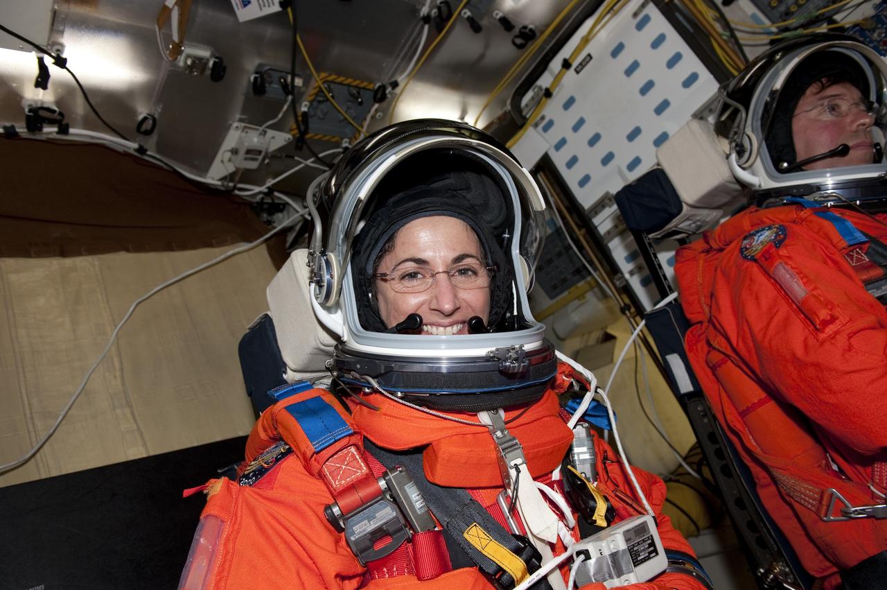 CAPE CANAVERAL, Fla. -- During a simulated launch countdown on Launch Pad 39A at NASA's Kennedy Space Center in Florida, STS-133 Mission Specialists Nicole Stott, left, and Michael Barratt are strapped into their seats on space shuttle Discovery. Next, they will practice escaping the shuttle, in preparation for an unlikely emergency at the pad on launch day. The simulated launch countdown and emergency exit training are part of a week-long Terminal Countdown Demonstration Test (TCDT). Discovery and its STS-133 crew will deliver the Permanent Multipurpose Module, packed with supplies and critical spare parts, as well as Robonaut 2, the dexterous humanoid astronaut helper, to the International Space Station. Launch is targeted for Nov. 1 at 4:40 p.m. For more information on the STS-133 mission, visit www.nasa.gov/mission_pages/shuttle/shuttlemissions/sts133/. Photo credit: NASA/Kim Shiflett