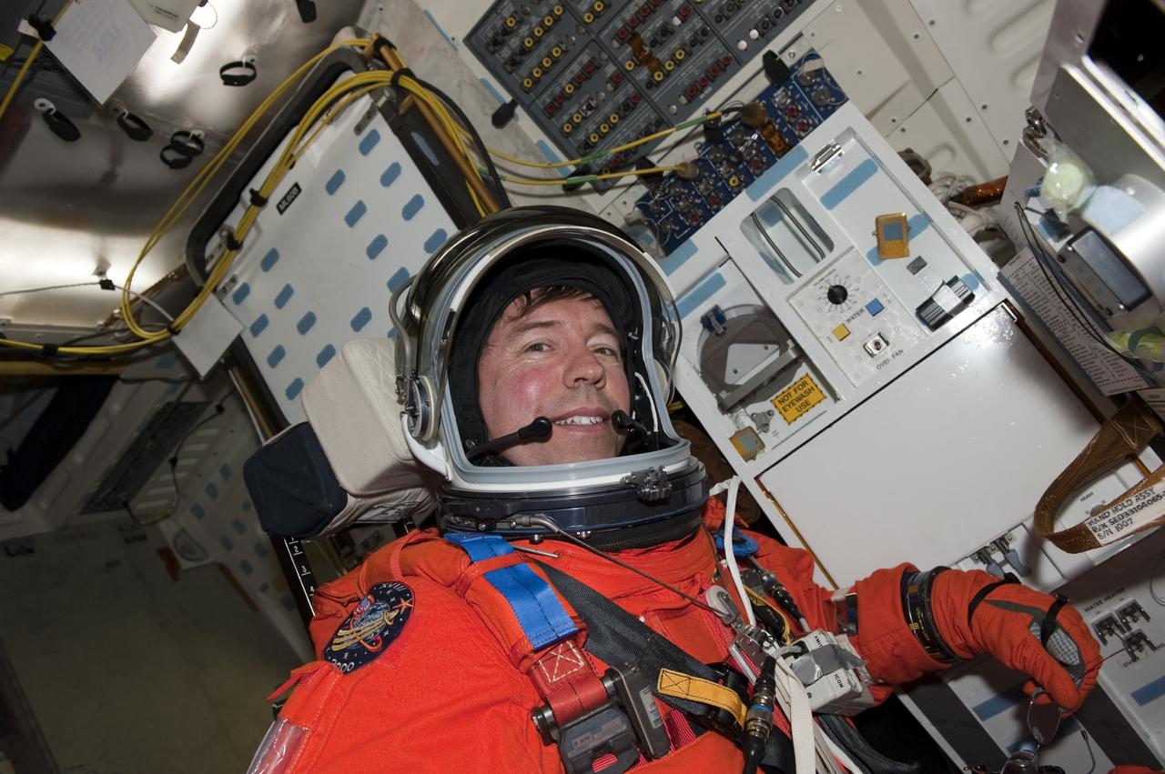 CAPE CANAVERAL, Fla. -- During a simulated launch countdown on Launch Pad 39A at NASA's Kennedy Space Center in Florida, STS-133 Mission Specialist Michael Barratt is strapped into his seat on space shuttle Discovery. Next, the crew members will practice escaping the shuttle, in preparation for an unlikely emergency at the pad on launch day. The simulated launch countdown and emergency exit training are part of a week-long Terminal Countdown Demonstration Test (TCDT). Discovery and its STS-133 crew will deliver the Permanent Multipurpose Module, packed with supplies and critical spare parts, as well as Robonaut 2, the dexterous humanoid astronaut helper, to the International Space Station. Launch is targeted for Nov. 1 at 4:40 p.m. For more information on the STS-133 mission, visit www.nasa.gov/mission_pages/shuttle/shuttlemissions/sts133/. Photo credit: NASA/Kim Shiflett