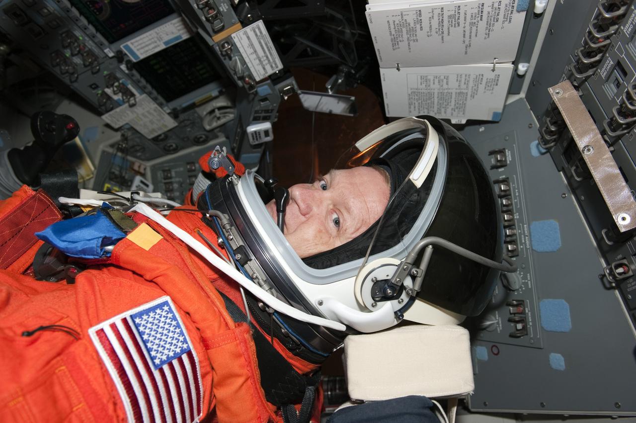 CAPE CANAVERAL, Fla. -- During a simulated launch countdown on Launch Pad 39A at NASA's Kennedy Space Center in Florida, STS-133 Pilot Eric Boe is strapped into his seat on space shuttle Discovery. Next, the crew members will practice escaping the shuttle, in preparation for an unlikely emergency at the pad on launch day. The simulated launch countdown and emergency exit training are part of a week-long Terminal Countdown Demonstration Test (TCDT).        Discovery and its STS-133 crew will deliver the Permanent Multipurpose Module, packed with supplies and critical spare parts, as well as Robonaut 2, the dexterous humanoid astronaut helper, to the International Space Station. Launch is targeted for Nov. 1 at 4:40 p.m. For more information on the STS-133 mission, visit www.nasa.gov/mission_pages/shuttle/shuttlemissions/sts133/. Photo credit: NASA/Kim Shiflett