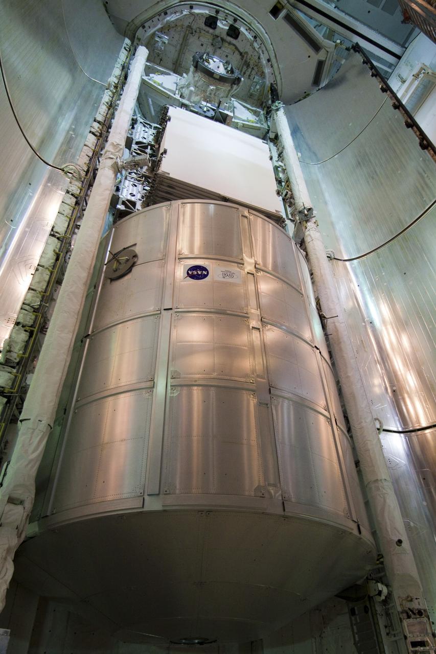 CAPE CANAVERAL, Fla. -- On Launch Pad 39A at NASA's Kennedy Space Center in Florida, the clamshell doors of space shuttle Discovery's payload bay are ready to be closed in preparation for the STS-133 launch to the International Space Station.    Targeted to launch Nov. 1, STS-133 will carry the Permanent Multipurpose Module (PMM) packed with supplies and critical spare parts, as well as Robonaut 2 (R2) to the station. Photo credit: NASA/Jack Pfaller