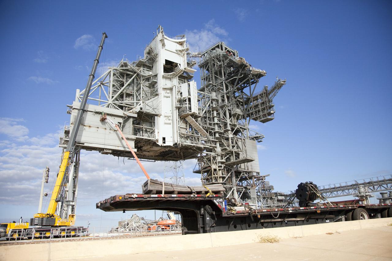 CAPE CANAVERAL, Fla. -- At NASA's Kennedy Space Center in Florida, the rotating service structure (RSS) on Launch Pad 39B is being dismantled. Starting in 2009, the structure at the pad was no longer needed for NASA's Space Shuttle Program, so it is being restructured for future use. The new design will feature a "clean pad" for rockets to come with their own launcher, making it more versatile for a number of vehicles.       For information on NASA's future plans, visit www.nasa.gov. Photo credit: NASA/Frankie Martin