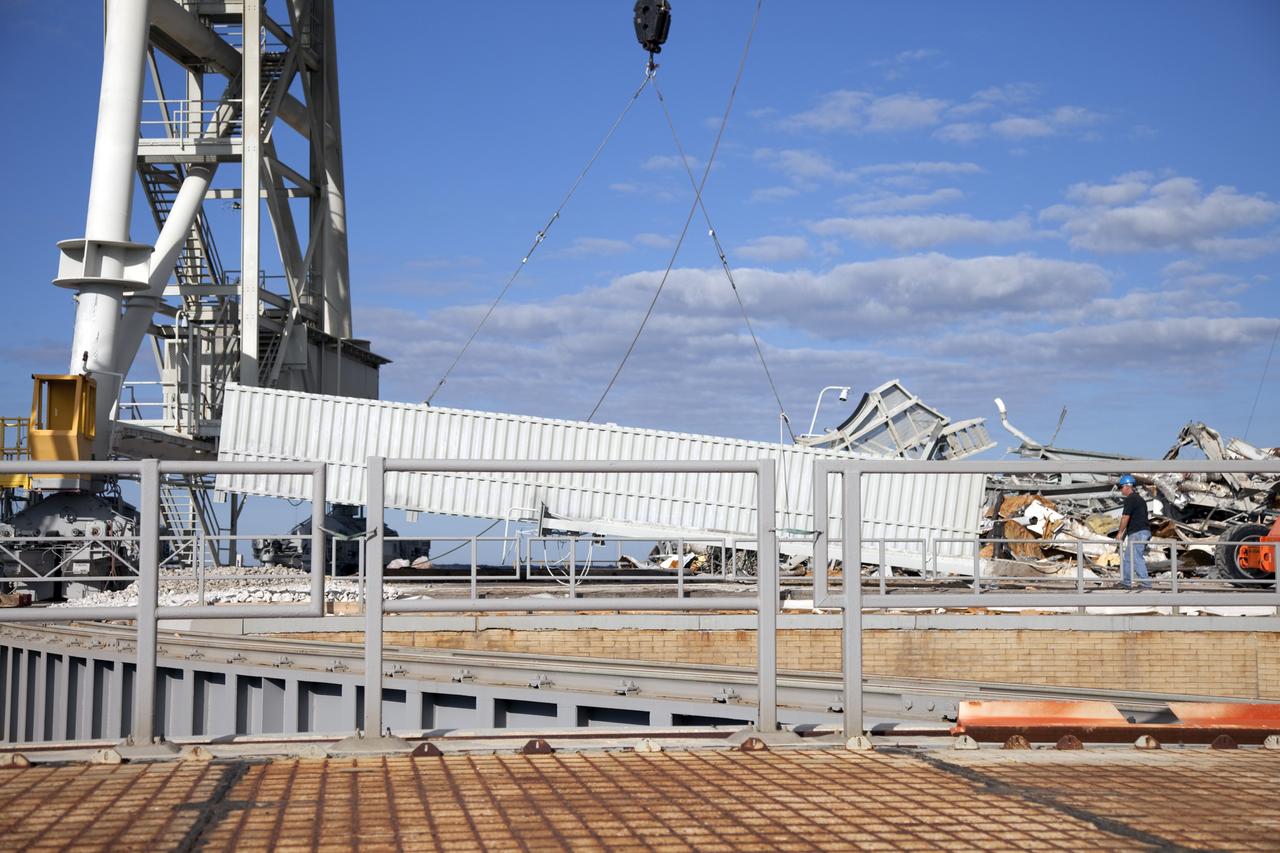 CAPE CANAVERAL, Fla. -- At NASA's Kennedy Space Center in Florida, the rotating service structure (RSS) on Launch Pad 39B is being dismantled. Starting in 2009, the structure at the pad was no longer needed for NASA's Space Shuttle Program, so it is being restructured for future use. The new design will feature a "clean pad" for rockets to come with their own launcher, making it more versatile for a number of vehicles.     For information on NASA's future plans, visit www.nasa.gov. Photo credit: NASA/Frankie Martin