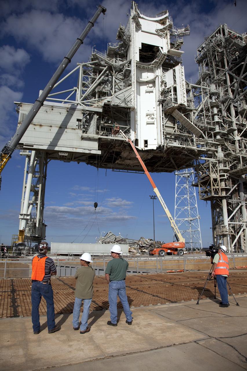 CAPE CANAVERAL, Fla. -- At NASA's Kennedy Space Center in Florida, the rotating service structure (RSS) on Launch Pad 39B is being dismantled. Starting in 2009, the structure at the pad was no longer needed for NASA's Space Shuttle Program, so it is being restructured for future use. The new design will feature a "clean pad" for rockets to come with their own launcher, making it more versatile for a number of vehicles.     For information on NASA's future plans, visit www.nasa.gov. Photo credit: NASA/Frankie Martin