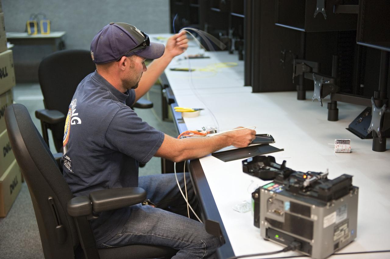 CAPE CANAVERAL, Fla. -- At NASA's Kennedy Space Center in Florida, rewiring of consoles and remodeling for launches of future human spaceflight vehicles take place in the Launch Control Center's Young-Crippen Firing Room. Known as Firing Room 1 in the Apollo era, it was re-named as a tribute to the Space Shuttle Program's first crewed mission, STS-1, which was flown by Commander John Young and Pilot Robert Crippen in April 1981. The firing room most recently was set up to support the Ares I-X flight test in Oct. 2009.     Photo credit: NASA/Kim Shiflett