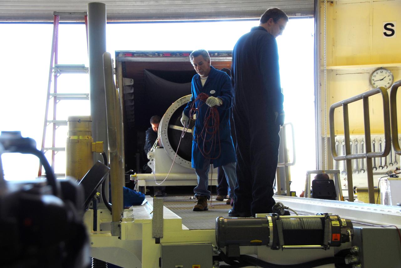 VANDENBERG AIR FORCE BASE, Calif. -- At Vandenberg Air Force Base in California, the third stage of the Pegasus XL rocket that will launch the Nuclear Spectroscopic Telescope Array (NuSTAR) to orbit is offloaded for processing in Building 1555. After the rocket and spacecraft are processed at Vandenberg, they will be shipped to the Ronald Reagan Ballistic Missile Defense Test Site located at the Pacific Ocean’s Kwajalein Atoll for launch.        The high-energy X-ray telescope will conduct a census for black holes, map radioactive material in young supernovae remnants, and study the origins of cosmic rays and the extreme physics around collapsed stars. Photo credit: NASA/Dan Liberotti, VAFB