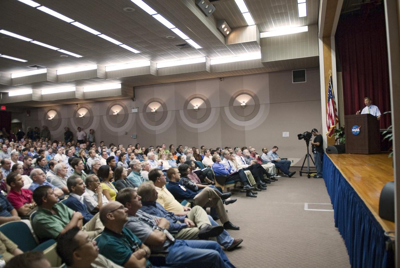 CAPE CANAVERAL, Fla. -- In the Training Auditorium at NASA's Kennedy Space Center in Florida, Professor Sam Ting talks to employees about the Alpha Magnetic Spectrometer-2 (AMS). Ting is the particle physics detector's principal investigator at the Massachusetts Institute of Technology.          AMS is designed to operate as an external module on the International Space Station. It will use the unique environment of space to study the universe and its origin by searching for dark matter. AMS-2 will fly to the station aboard space shuttle Endeavour's STS-134 mission targeted to launch Feb. 27, 2011. Photo credit: NASA/Jim Grossmann