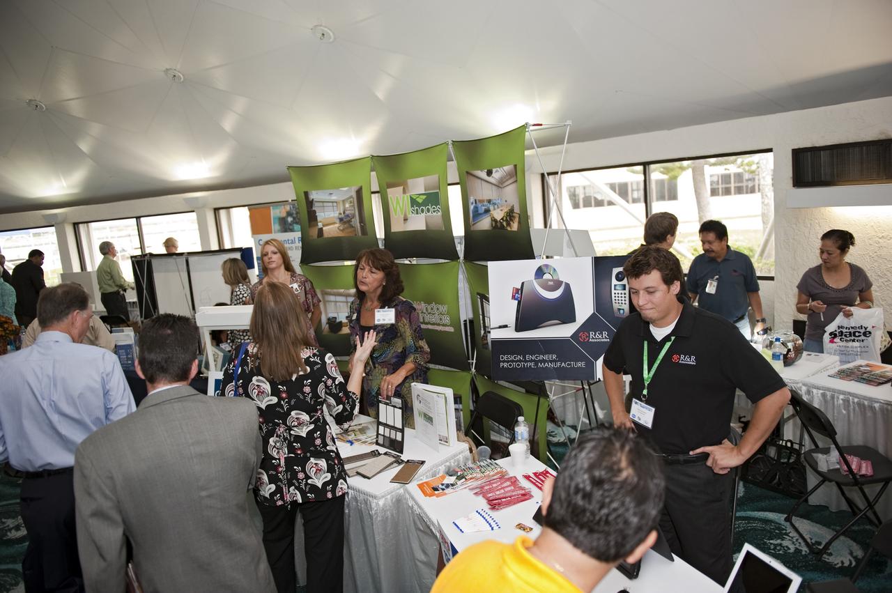 CAPE CANAVERAL, Fla. -- Business leaders interested in learning more about government contracting and what local and national vendors have to offer walk through the Business Opportunities Expo 2010 in Cruise Terminal 3 at Port Canaveral, Fla. The annual trade show is sponsored by NASA Kennedy Space Center's Prime Contractor Board, the 45th Space Wing and Canaveral Port Authority. It featured about 175 business and government exhibitors from across the nation and Brevard County.    NASA's Central Industry Assistance Office provides support to small businesses that want to do business at Kennedy. This office works with the NASA Kennedy Prime Contractor Board, which consists of many of the center's prime contractors to help small businesses learn how to navigate in the world of government contracting. By co-sponsoring the expo, the board helps provide a one-stop shop for buyers and sellers. Photo credit: Kim Shiflett
