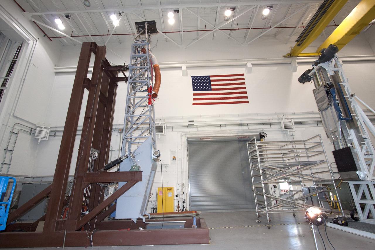 CAPE CANAVERAL, Fla. -- At NASA's Kennedy Space Center in Florida, testing of the Tilt-Up Umbilical Arm (TUUA) prototype's Environmental Control System Quick Disconnect takes place in the Launch Equipment Test Facility's 6,000-square-foot high bay. The prototype is used to demonstrate the safe disconnect and retraction of ground umbilical plates and associated hardware of a launch vehicle's upper stage and service module. The Environmental Control System consists of regulated air, which would be used to purge an inner tank and crew module.         Since 1977, the facility has supported NASA’s Launch Services, shuttle, International Space Station, and Constellation programs, as well as commercial providers. The facility recently underwent a major upgrade to support even more programs, projects and customers. It houses a cable fabrication and molding shop, pneumatics shop, machine and weld shop and full-scale control room. Outside, the facility features a water flow test loop, vehicle motion simulator, 600-ton test fixture, launch simulation towers and a cryogenic system. Photo credit: NASA/Jack Pfaller