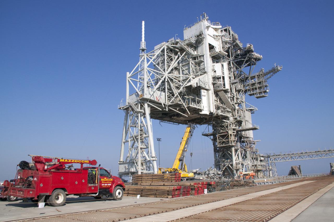 CAPE CANAVERAL, Fla. -- At NASA's Kennedy Space Center in Florida, the rotating service structure (RSS) on Launch Pad 39B is being dismantled. Starting in 2009, the structure at the pad was no longer needed for NASA's Space Shuttle Program, so it is being restructured for future use. The new design will feature a "clean pad" for rockets to come with their own launcher, making it more versatile for a number of vehicles.    For information on NASA's future plans, visit www.nasa.gov. Photo credit: NASA/Jack Pfaller
