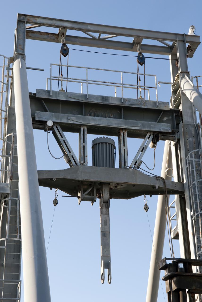 CAPE CANAVERAL, Fla. -- At NASA's Kennedy Space Center in Florida, the 600-Ton Test Fixture outside the Launch Equipment Test Facility is prepared to conduct a 500,000-pound pull test of a bridge crane lifting element, which is used to lift space shuttles in the Vehicle Assembly Building. The fixture proofload tests, in tension and compression, a variety of ground support equipment, including slings, lifting beams and other critical lifting hardware that require periodic proofloading.        Since 1977, the facility has supported NASA’s Launch Services, shuttle, International Space Station, and Constellation programs, as well as commercial providers. The facility recently underwent a major upgrade to support even more programs, projects and customers. It houses a 6,000-square-foot high bay, cable fabrication and molding shop, pneumatics shop, machine and weld shop and full-scale control room. Outside, the facility features a water flow test loop, vehicle motion simulator, launch simulation towers and a cryogenic system. Photo credit: NASA/Jim Grossmann