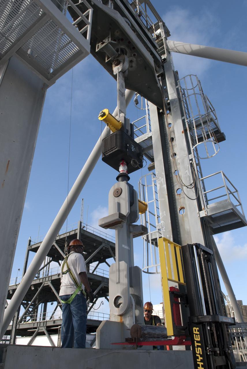 CAPE CANAVERAL, Fla. -- At NASA's Kennedy Space Center in Florida, the 600-Ton Test Fixture outside the Launch Equipment Test Facility conducts a 500,000-pound pull test of a bridge crane lifting element, which is used to lift space shuttles in the Vehicle Assembly Building. The fixture proofload tests, in tension and compression, a variety of ground support equipment, including slings, lifting beams and other critical lifting hardware that require periodic proofloading.      Since 1977, the facility has supported NASA’s Launch Services, shuttle, International Space Station, and Constellation programs, as well as commercial providers. The facility recently underwent a major upgrade to support even more programs, projects and customers. It houses a 6,000-square-foot high bay, cable fabrication and molding shop, pneumatics shop, machine and weld shop and full-scale control room. Outside, the facility features a water flow test loop, vehicle motion simulator, launch simulation towers and a cryogenic system. Photo credit: NASA/Jim Grossmann