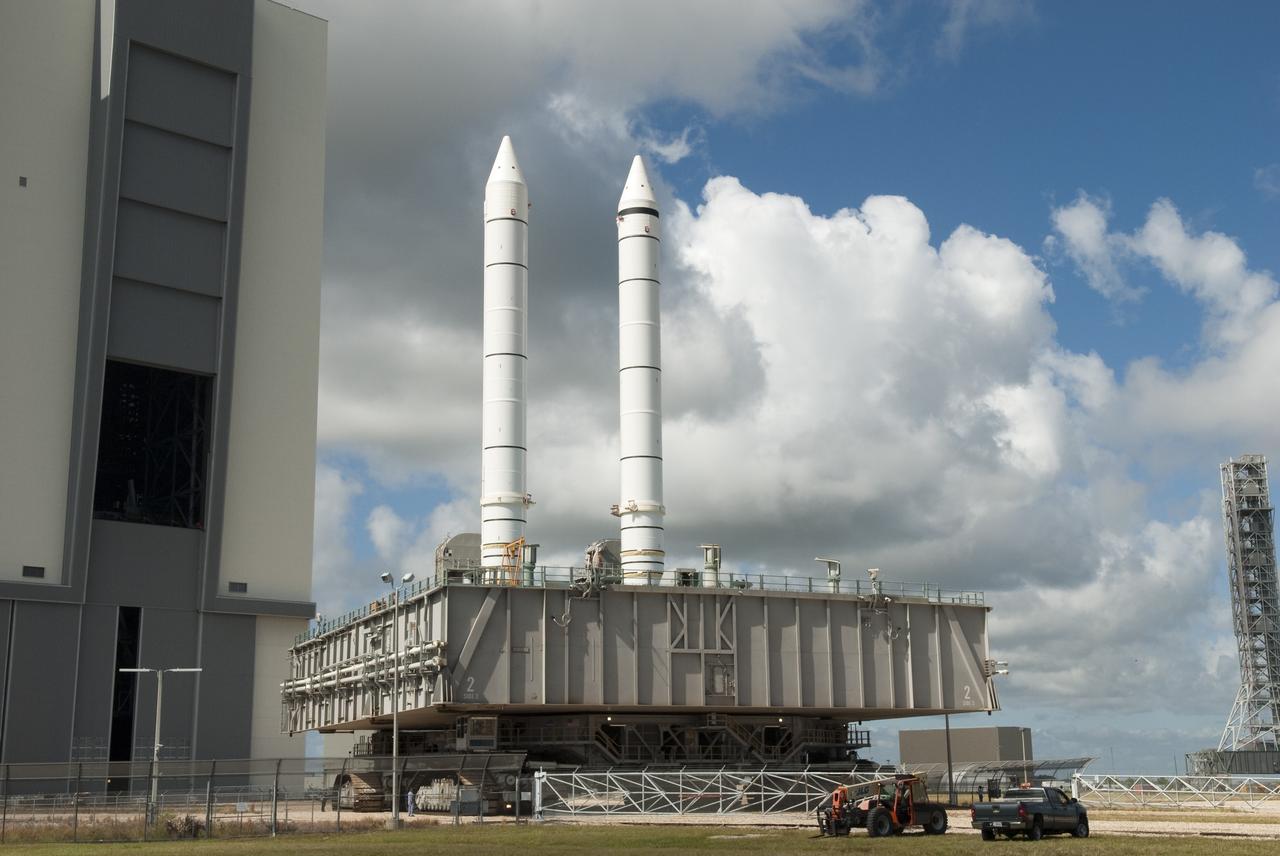 CAPE CANAVERAL, Fla. -- At NASA's Kennedy Space Center in Florida, a crawler-transporter moves a mobile launcher platform with two solid rocket boosters perched on top from the Vehicle Assembly Building's (VAB) High Bay 1 to High Bay 3. Inside the VAB, the boosters will be joined to an external fuel tank next month in preparation for space shuttle Endeavour's STS-134 mission to the International Space Station targeted to launch in February, 2011. For more information visit: http://www.nasa.gov/mission_pages/shuttle/shuttlemissions/sts134/index.html Photo credit: NASA/Jim Grossmann