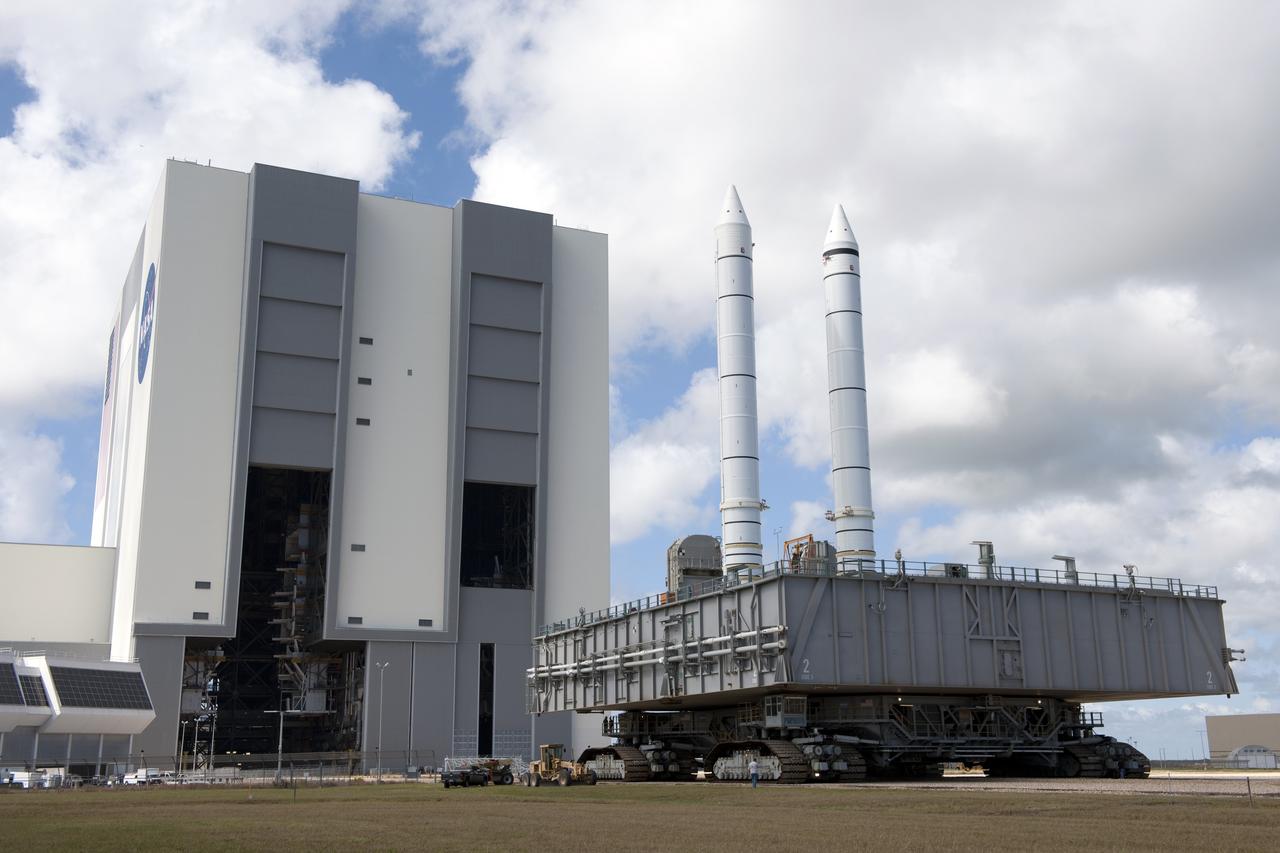 CAPE CANAVERAL, Fla. -- At NASA's Kennedy Space Center in Florida, a crawler-transporter moves a mobile launcher platform with two solid rocket boosters perched on top from the Vehicle Assembly Building's (VAB) High Bay 1 to High Bay 3.            Inside the VAB, the boosters will be joined to an external fuel tank next month in preparation for space shuttle Endeavour's STS-134 mission to the International Space Station targeted to launch in February, 2011. For more information visit: http://www.nasa.gov/mission_pages/shuttle/shuttlemissions/sts134/index.html Photo credit: NASA/Ben Cooper