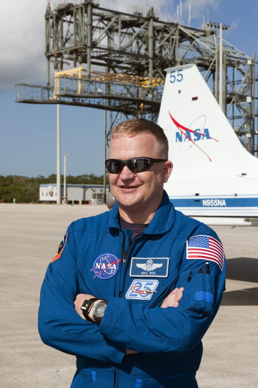 CAPE CANAVERAL, Fla. -- At NASA's Kennedy Space Center in Florida, space shuttle Discovery's STS-133 Pilot Eric Boe stands in front of a T-38 training jet that he flew from Houston to the Shuttle Landing Facility. In the days leading up to their launch to the International Space Station, Boe and his crew members will check the fit of their launch-and-entry suits, review launch-day procedures, receive weather briefings and remain medically quarantined to prevent sickness.    Scheduled to lift off Nov. 1 at 4:40 p.m., Discovery and crew will deliver the Permanent Multipurpose Module, packed with supplies and critical spare parts, as well as Robonaut 2, the dexterous humanoid astronaut helper, to the orbiting outpost. For more information on the STS-133 mission, visit www.nasa.gov/mission_pages/shuttle/shuttlemissions/sts133/. Photo credit: NASA/Kim Shiflett