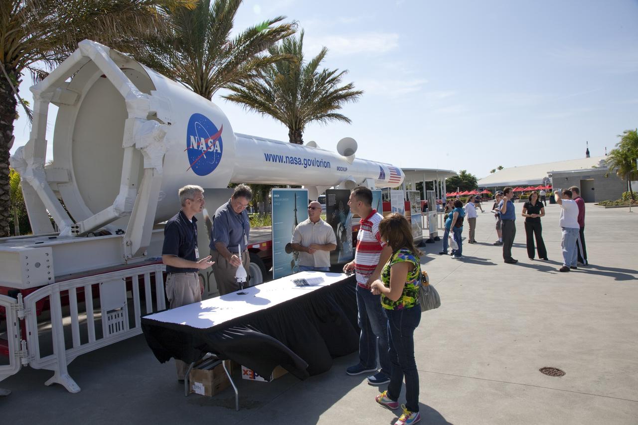 CAPE CANAVERAL, Fla. -- Tourists check out the Orion launch abort system mock-up, called pathfinder, at the Kennedy Space Center Visitor Complex in Florida. The nearly 45-foot-long mock-up traveled from the U.S. Army's White Sands Missile Range in New Mexico aboard a flatbed trailer, making stops at museums and science centers in Denver, Illinois, Ohio, Pennsylvania and Virginia along the way. Before its cross-country journey, the mock-up was used to practice lifting and stacking operations for the Pad Abort-1 flight test at White Sands. Next, it will be used at Kennedy for similar operations. For information on NASA's future plans, visit www.nasa.gov. Photo credit: NASA/Frankie Martin