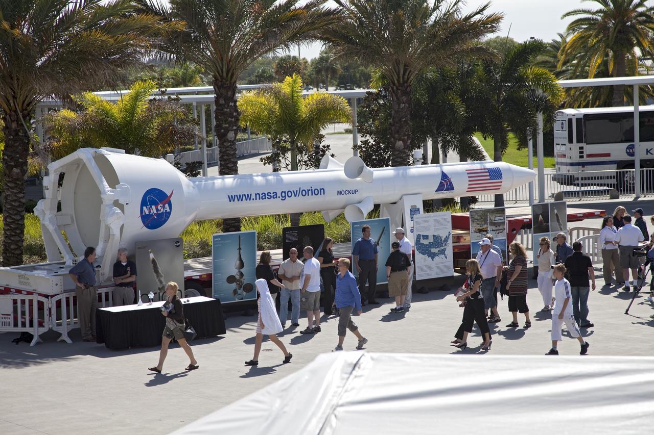CAPE CANAVERAL, Fla. -- Tourists check out the Orion launch abort system mock-up, called pathfinder, at the Kennedy Space Center Visitor Complex in Florida. The nearly 45-foot-long mock-up traveled from the U.S. Army's White Sands Missile Range in New Mexico aboard a flatbed trailer, making stops at museums and science centers in Denver, Illinois, Ohio, Pennsylvania and Virginia along the way. Before its cross-country journey, the mock-up was used to practice lifting and stacking operations for the Pad Abort-1 flight test at White Sands. Next, it will be used at Kennedy for similar operations. For information on NASA's future plans, visit www.nasa.gov. Photo credit: NASA/Frankie Martin