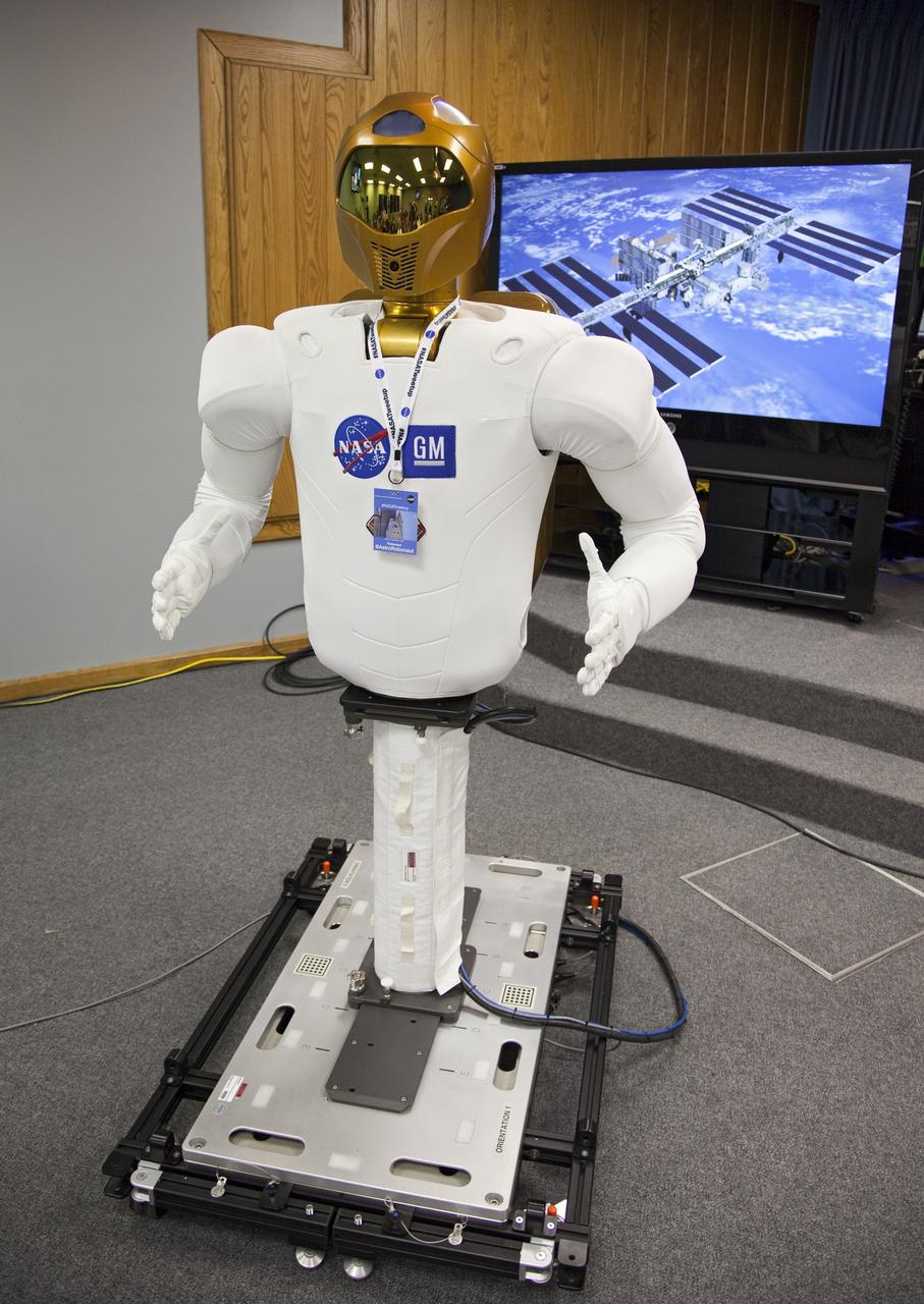 CAPE CANAVERAL, Fla. -- At NASA's Kennedy Space Center in Florida, a dexterous humanoid astronaut helper, known as Robonaut, is on display for participants of the STS-133 Tweetup. Robonaut 2 (R2) will be delivered to the International Space Station on space shuttle Discovery's STS-133 mission. Although R2 will initially only participate in operational tests, upgrades could eventually allow the robot to realize its true purpose -- helping spacewalking astronauts with tasks outside the orbiting laboratory. NASA is hosting about 150 of its Twitter followers from around the world and several dozen states and providing them with a behind-the-scenes perspective to share with their own followers on the social networking service. The "Tweeps," as NASA calls them, will have a chance to tour Kennedy, meet with shuttle technicians, managers, engineers and astronauts, and witness Discovery's launch. Discovery and its STS-133 crew are scheduled to lift off Nov. 3 at 3:52 p.m. EDT. For more information on the upcoming mission, visit www.nasa.gov/mission_pages/shuttle/shuttlemissions/sts133/. Photo credit: NASA/Frank Michaux